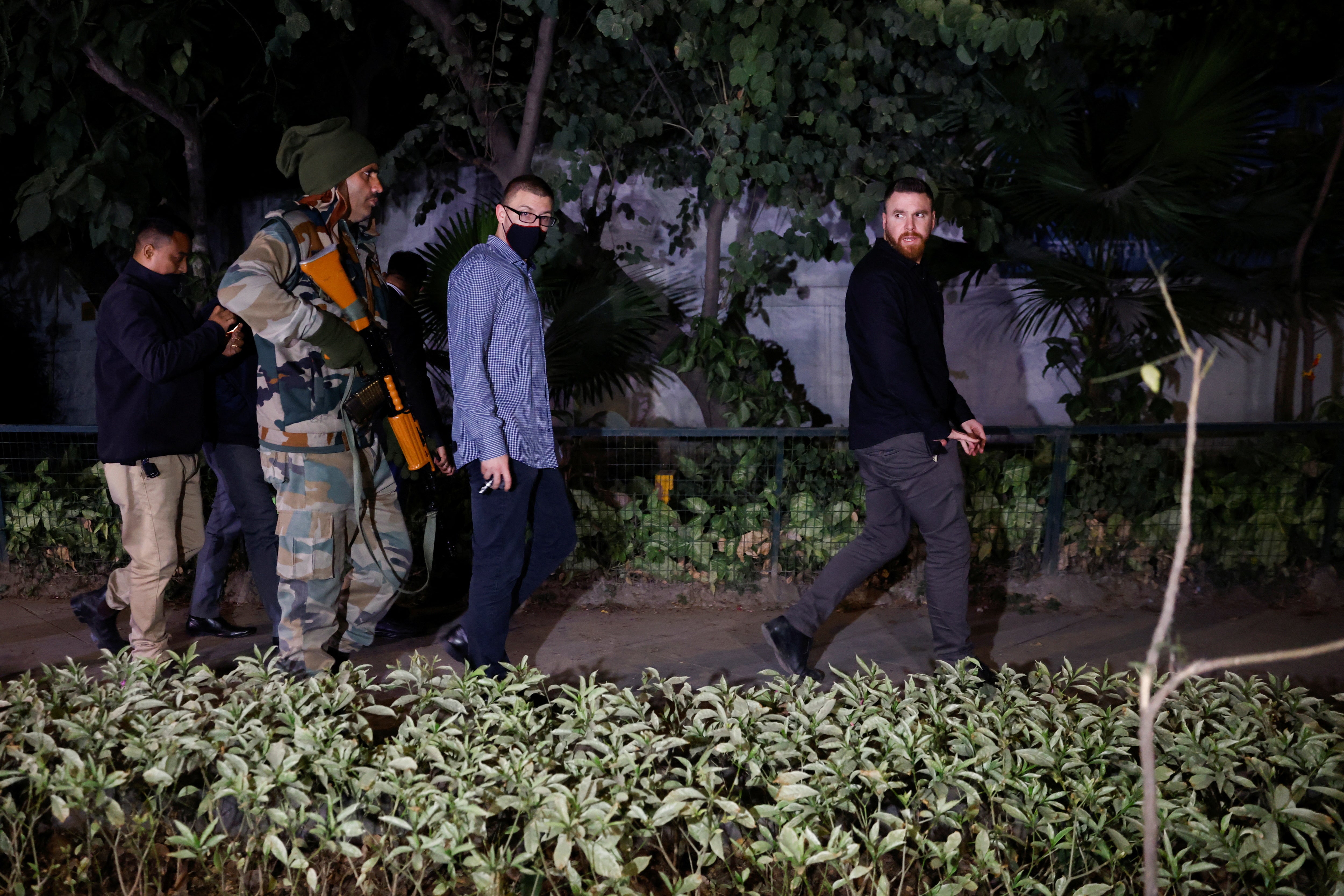 Israel embassy officials and members of the security forces check the area, following a reported explosion nearby, in New Delhi, India