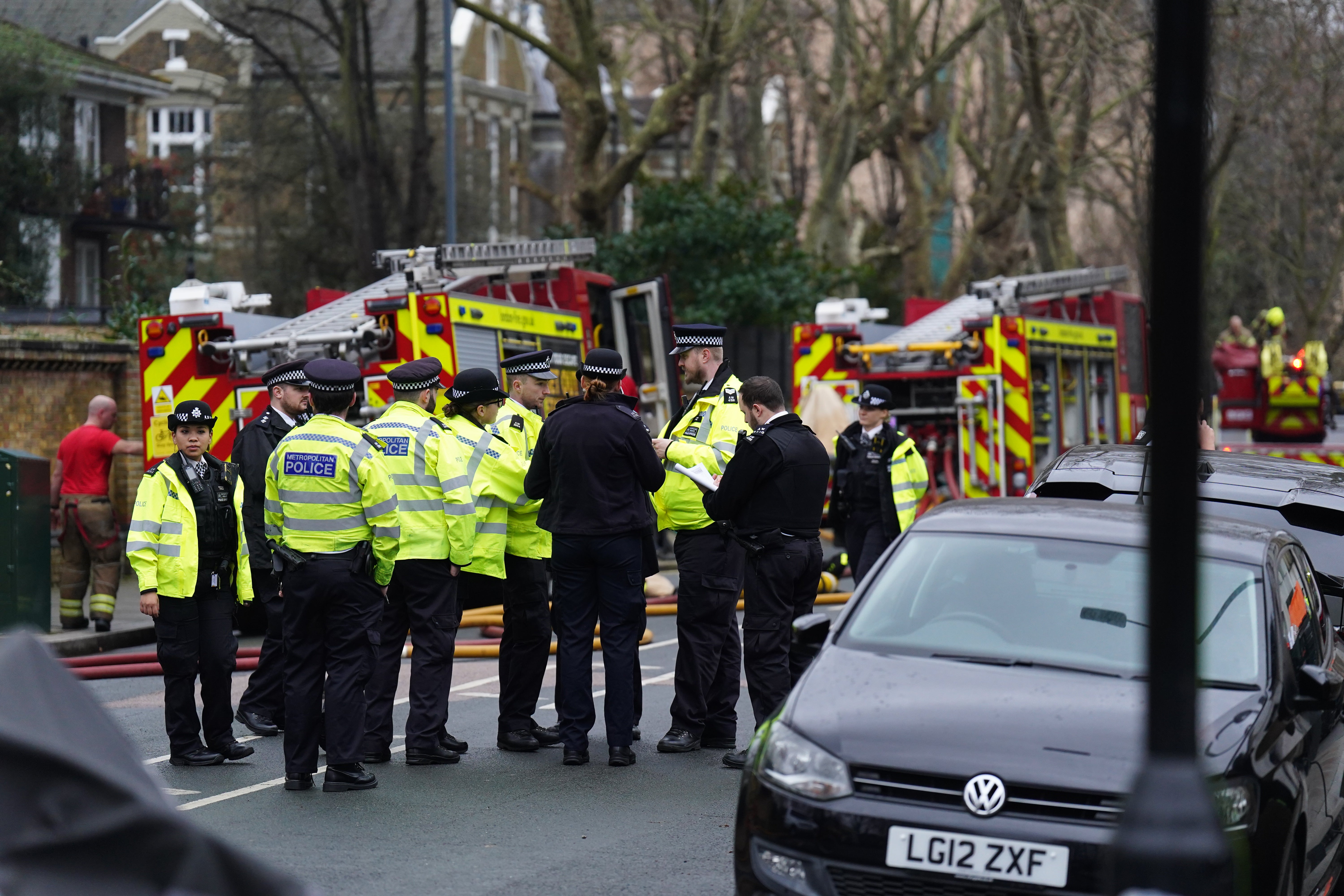 Fire engines and police officers on Seagrave Road in Fulham, west London, as firefighters tackle a blaze at London Oratory Schoo