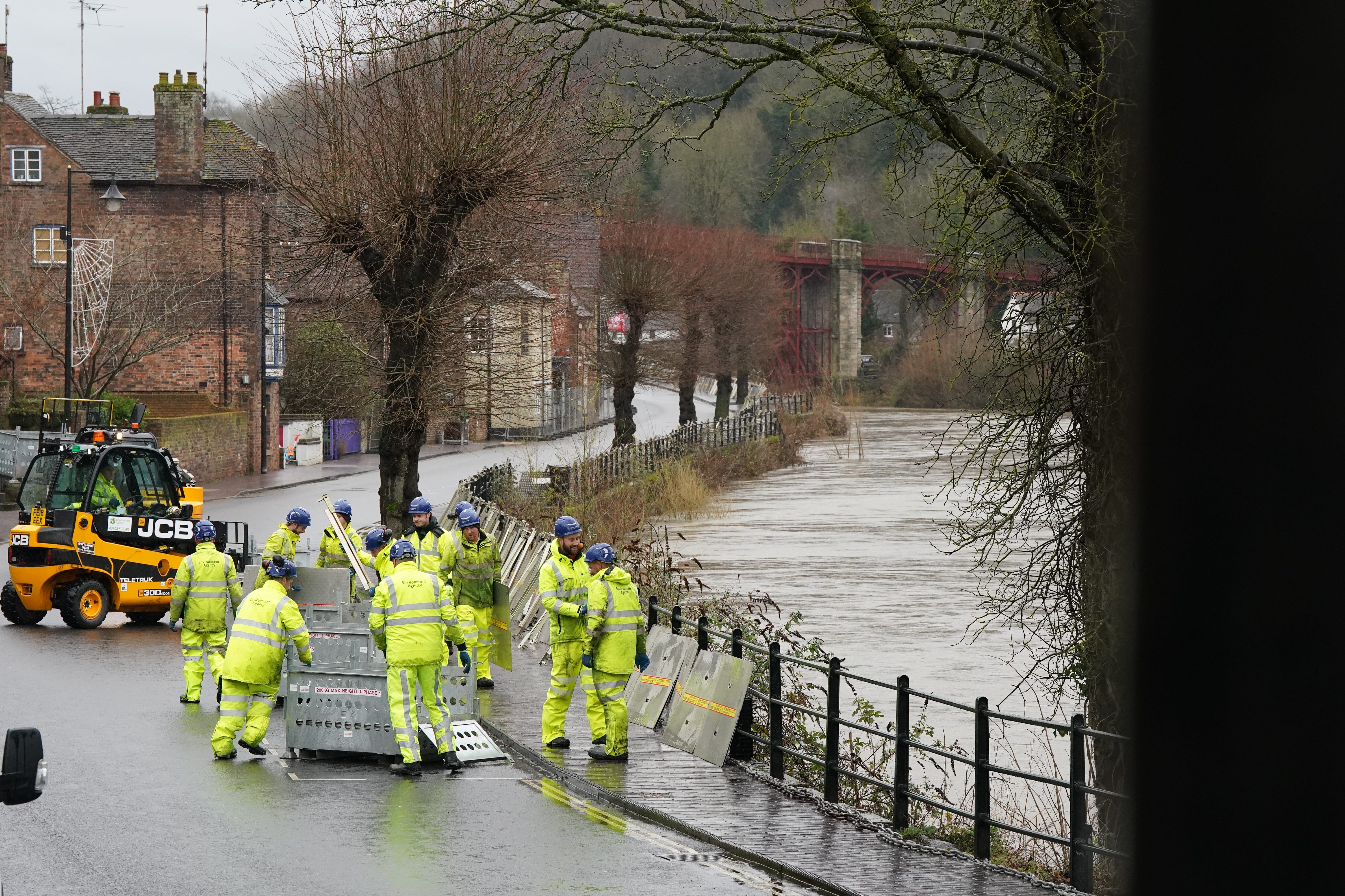 The River Severn has risen, causing flood defences to be put in place along the wharf at Ironbridge