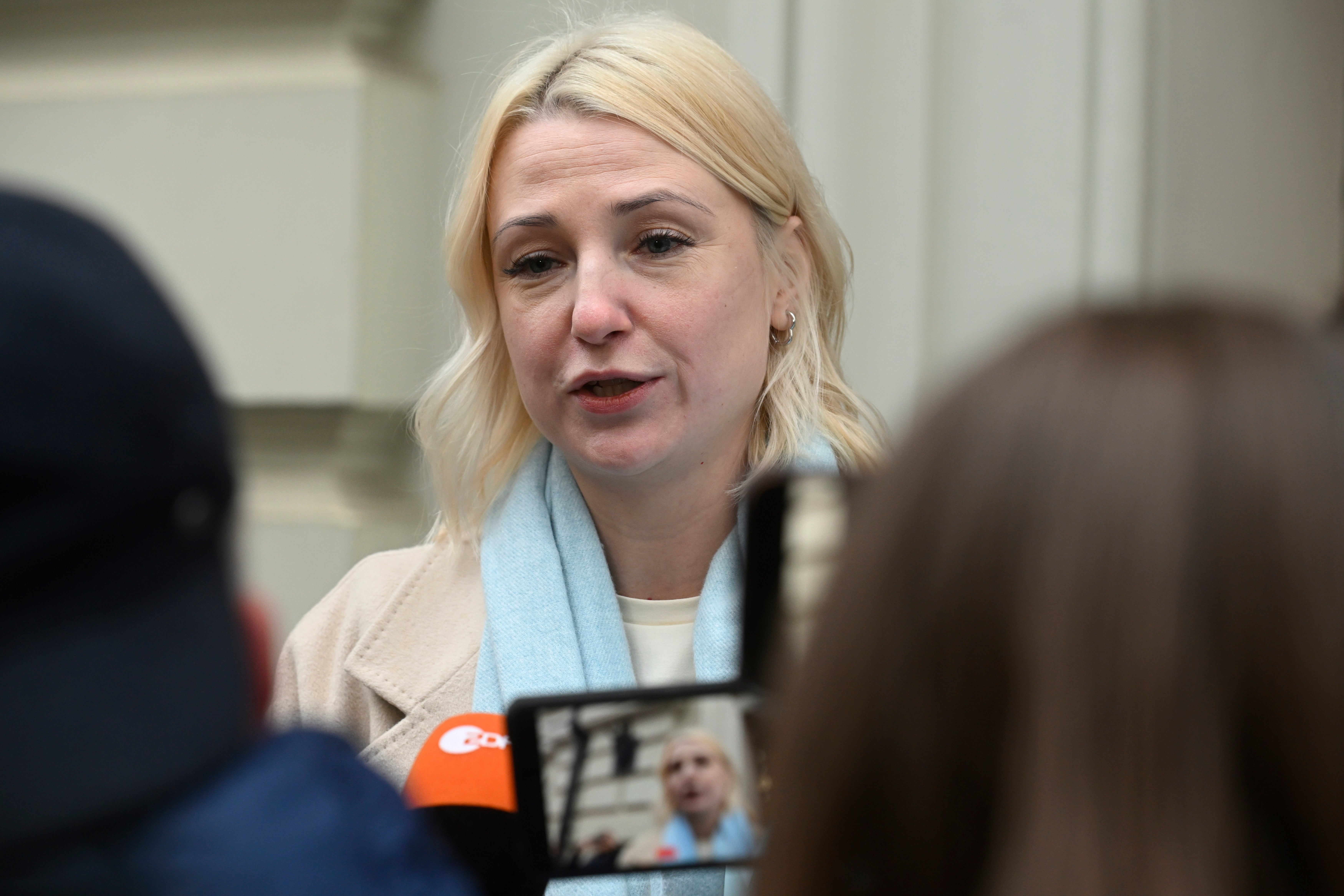 Ms Duntsova speaks to reporters outside the Russian courts after being barred from running in the presidential election