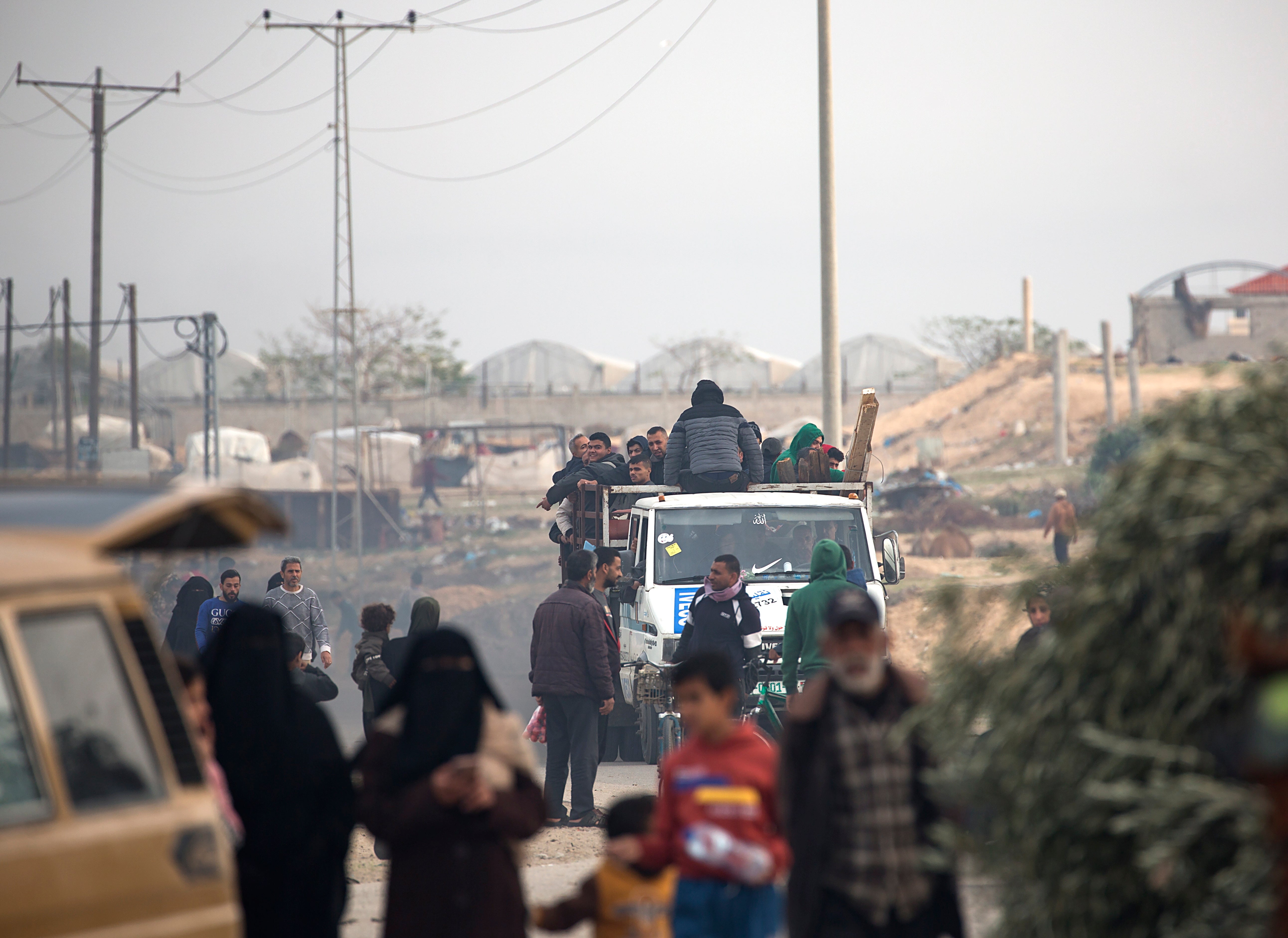 Displaced Palestinians from the Nuseirat, Bureij and parts of the Khan Younis refugee camps make their way to the city of Rafah
