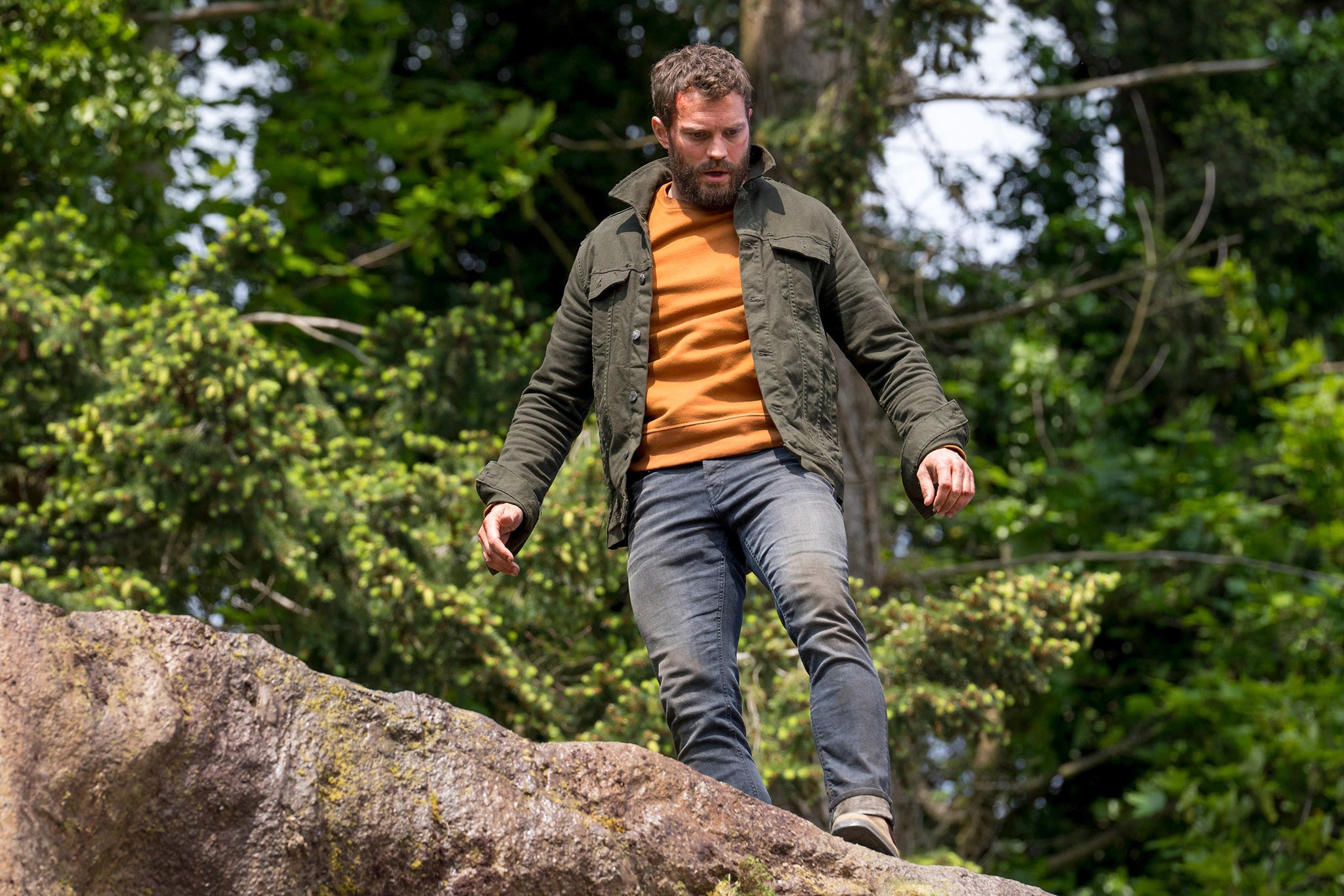 Man on the run: Dornan peers over a cliff edge in the second series of BBC One’s ‘The Tourist’