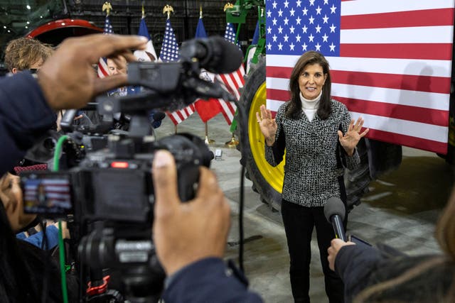 <p>Former UN ambassador and 2024 presidential hopeful Nikki Haley speaks with the press during a Town Hall event in Agency, Iowa, on December 19, 2023</p>