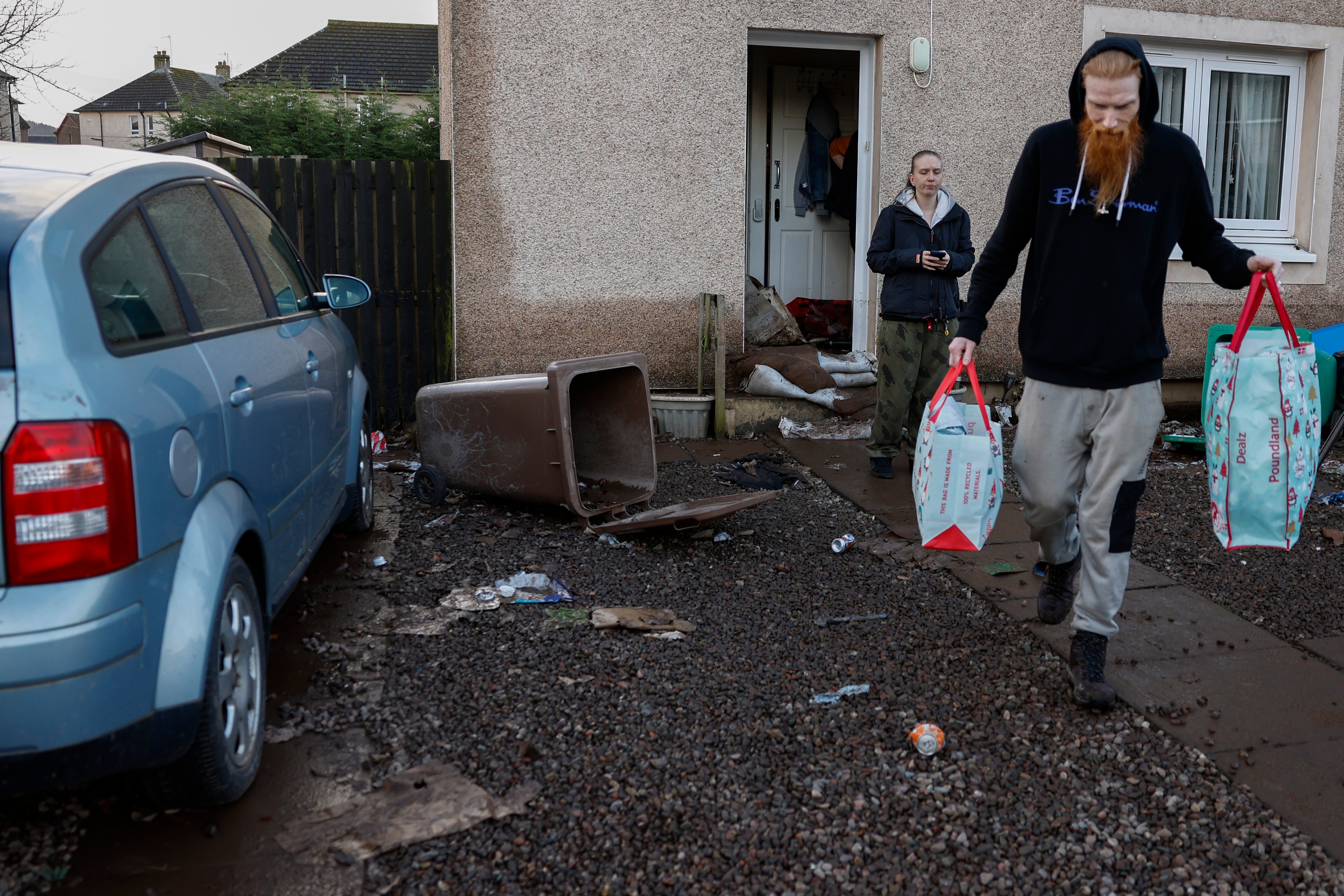 <p>Residents in the Kinloss Park area start to clear up following the affects of Storm Gerrit on December 28</p>