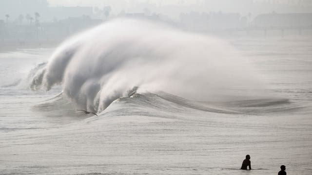 Huge surf pounds beaches on West Coast and in Hawaii with some low