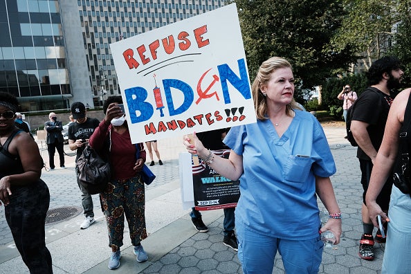 People participate in a rally and march against COVID-19 mandates on 13 September 2021 in New York City. President Joe Biden has supported and ordered mandates for federal workers