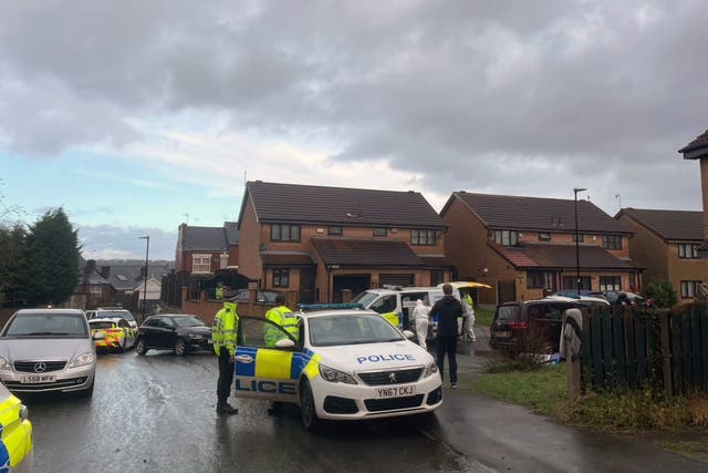 Police officers at the scene at College Court, Burngreave, after a 46-year-old man died and several others were injured (Dave Higgens/PA)