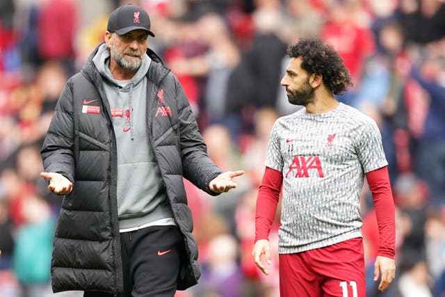 <p>Jurgen Klopp, left, is confident he can find a solution in Mohamed Salah’s January absence (Mike Egerton/PA)</p>