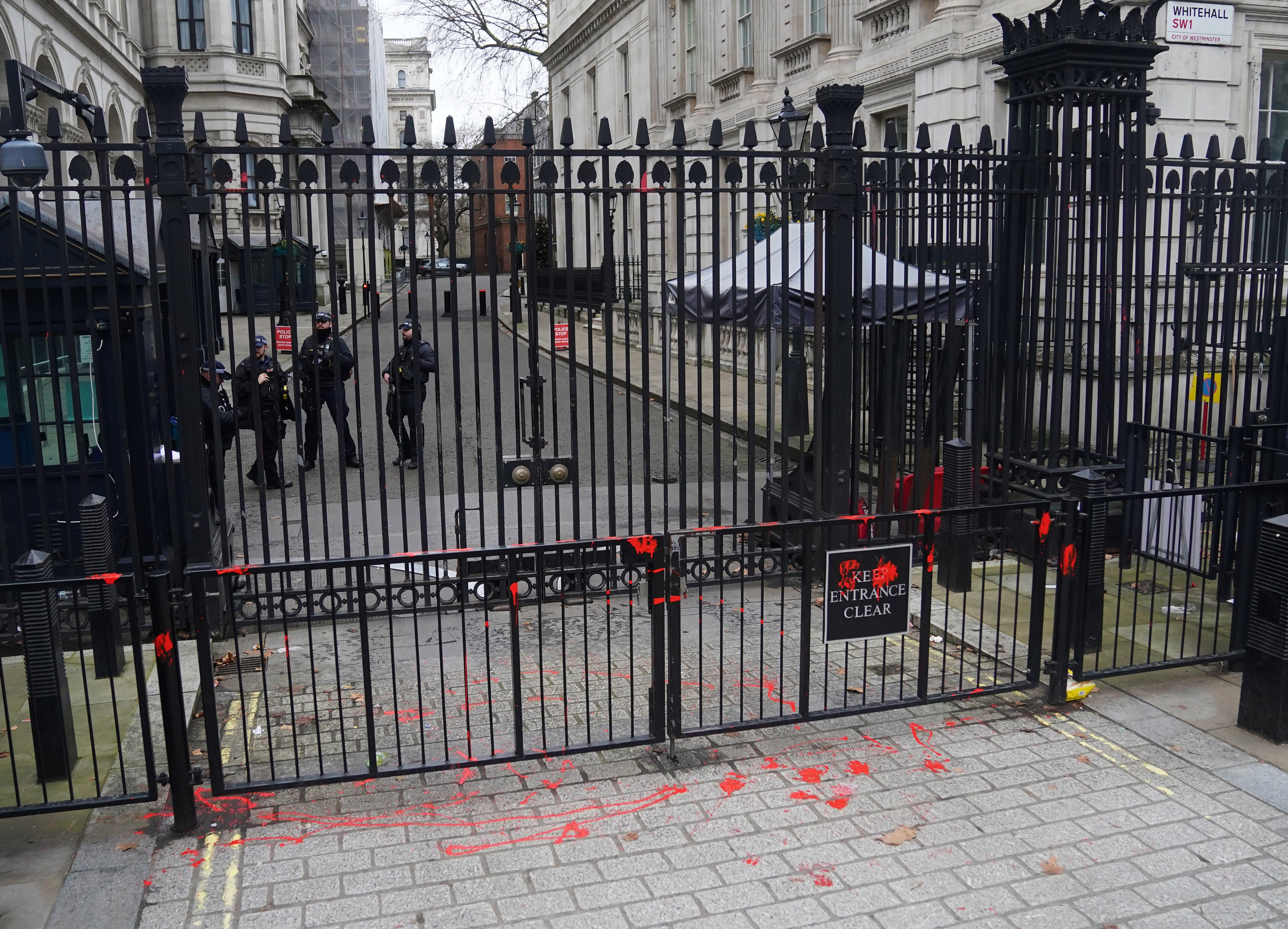 Red paint thrown on the gates of Downing Street in London