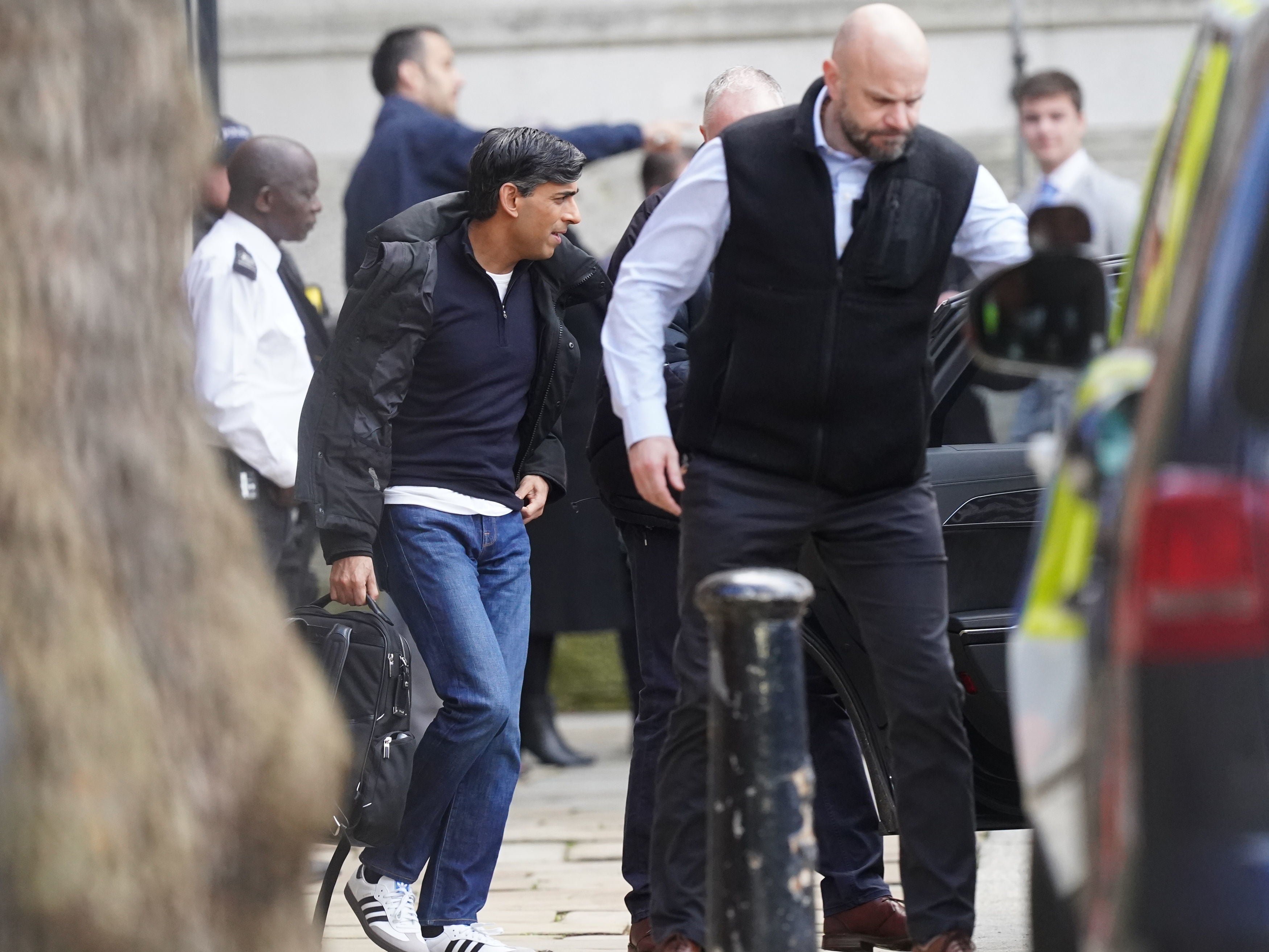Rishi Sunak exits Downing Street from rear entrance following protest