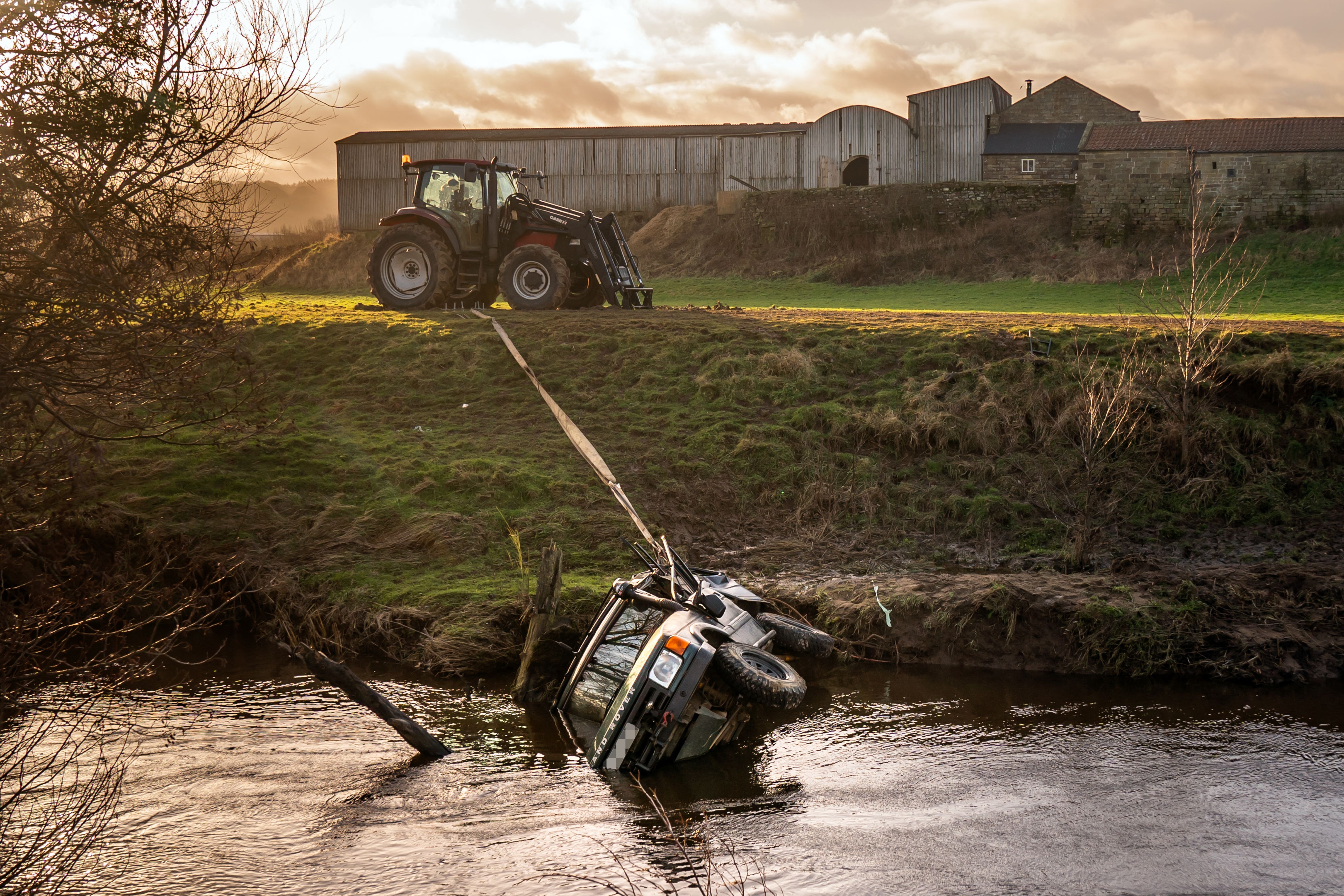 The vehicle was removed from the water using tethers (Danny Lawson/PA)