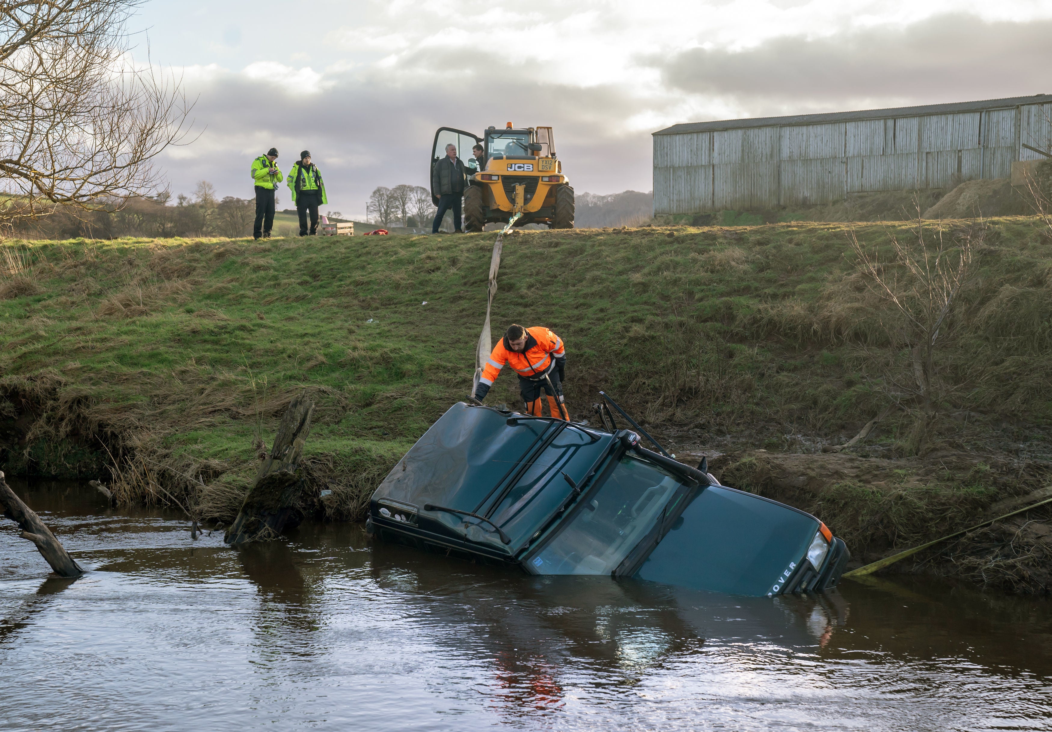 The vehicle being recovered from the River Esk