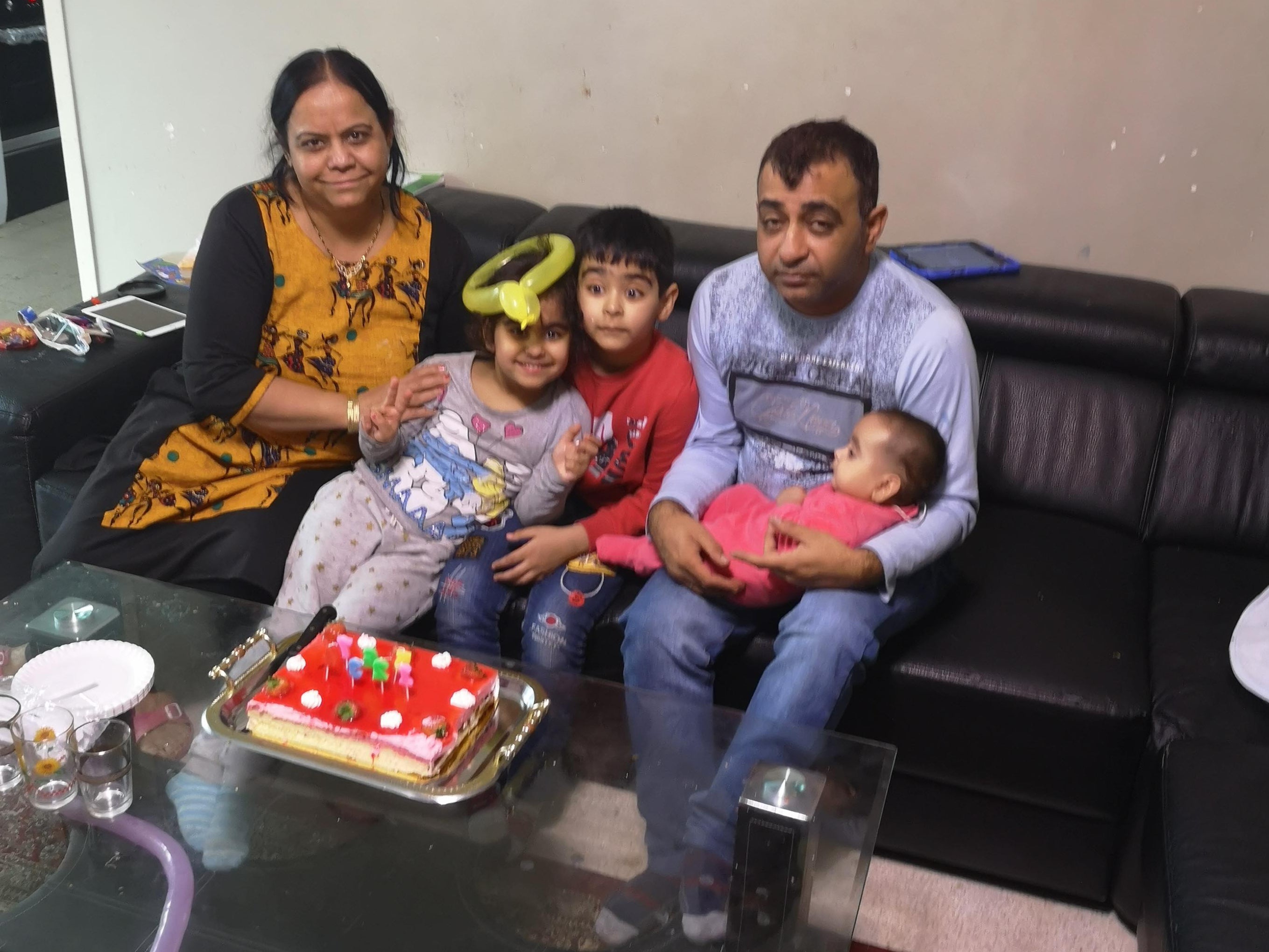 Aroen with his wife and three children who perished in the blaze