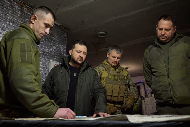<p>Volodymyr Zelensky, second left, looks at a map during his visit to Ukrainian 110th mechanised brigade in Avdiivka, the site of fierce battles with the Russian troops in the Donetsk region, Ukraine</p>