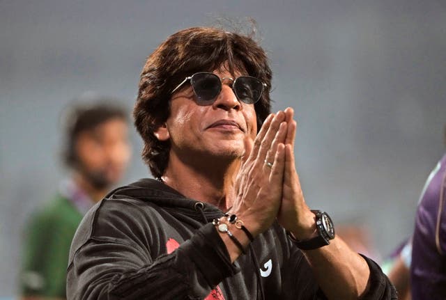 <p>Bollywood superstar Shah Rukh Khan acknowledges the crowd</p>