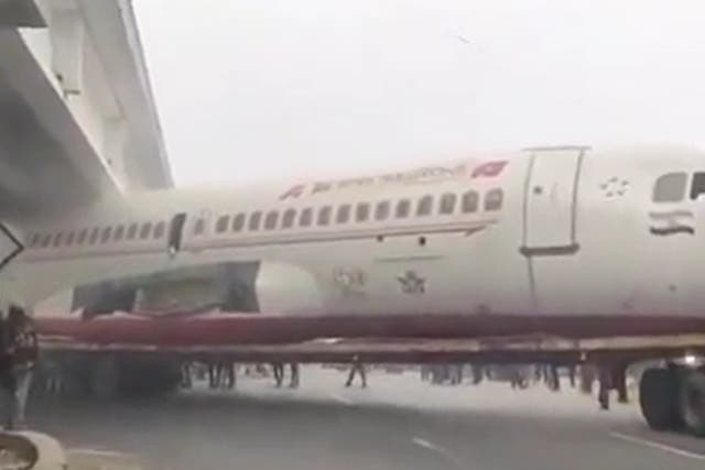 <p>Ex-Air India scrap plane gets stuck under bridge in Bihar, India </p>