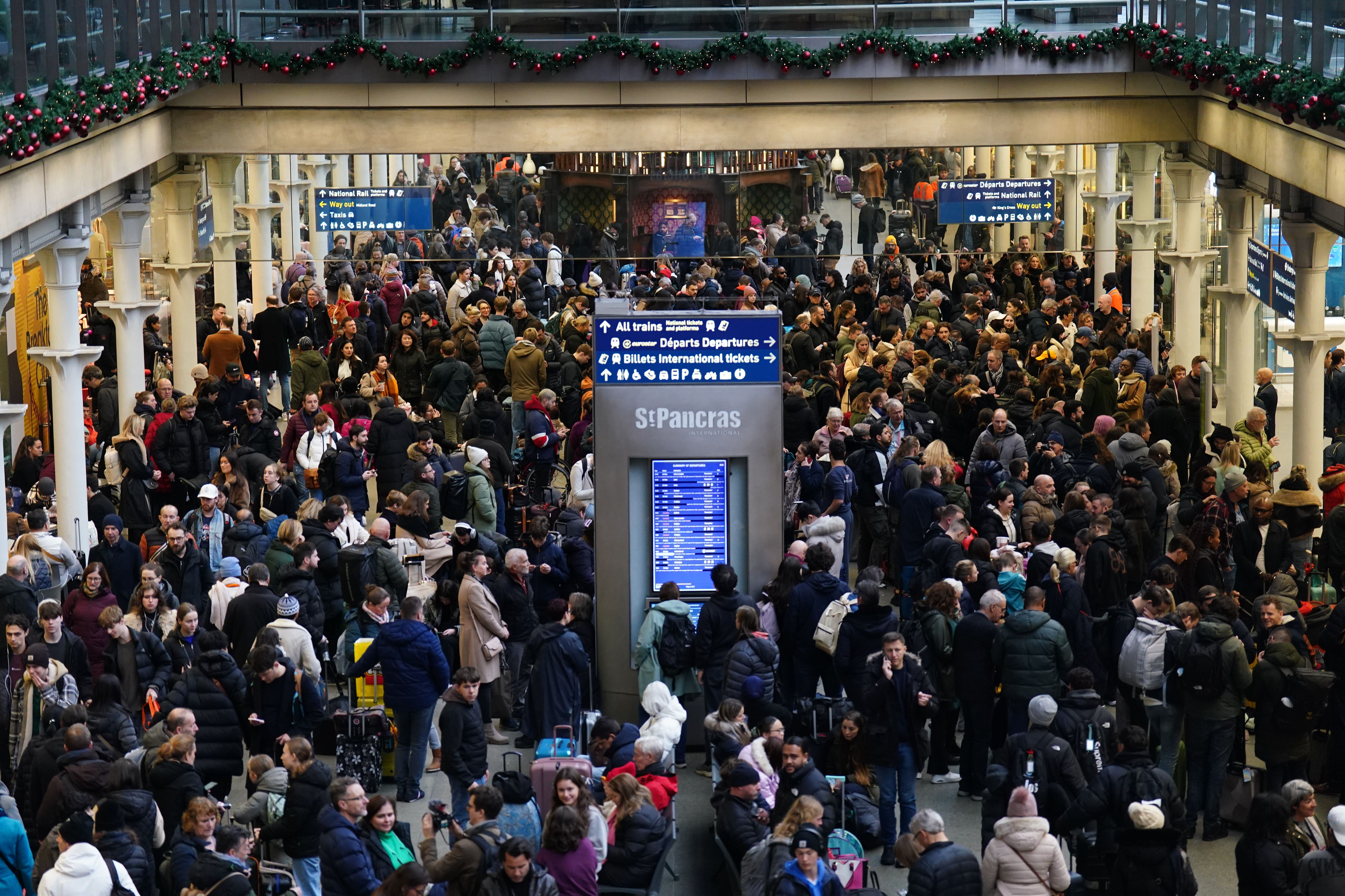 Passengers waited on the concourse at the entrance to Eurostar in St Pancras International station on Saturday