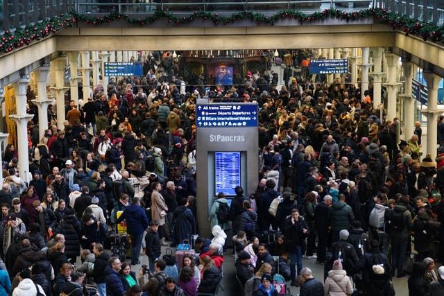 <p>Passengers wait on the concourse at the entrance to Eurostar in St Pancras International station </p>