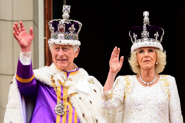 The King and Queen on the balcony of Buckingham Palace following the coronation (Leon Neal/PA)