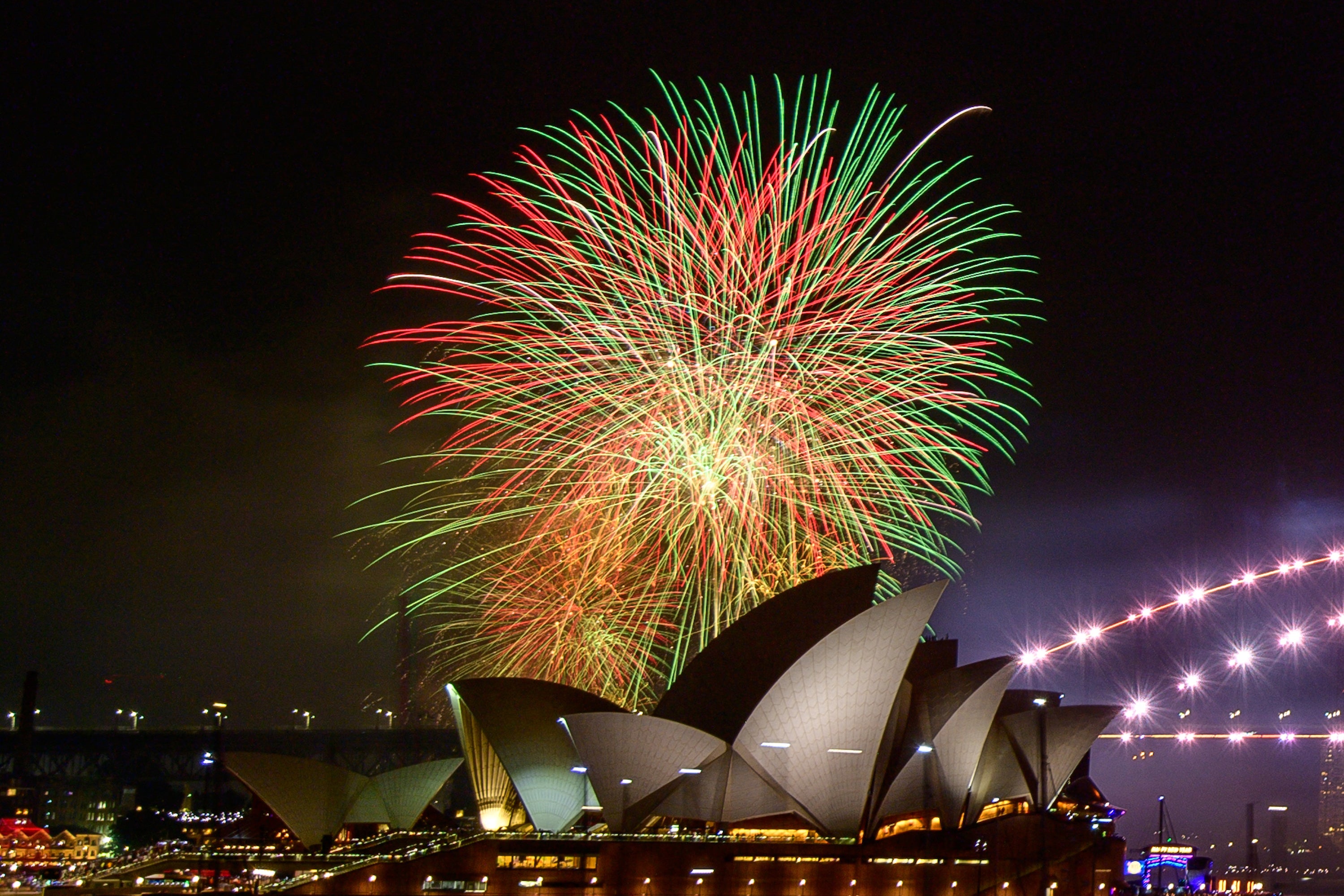 Fireworks explode over the Opera House, which is also marking its 50th anniversary