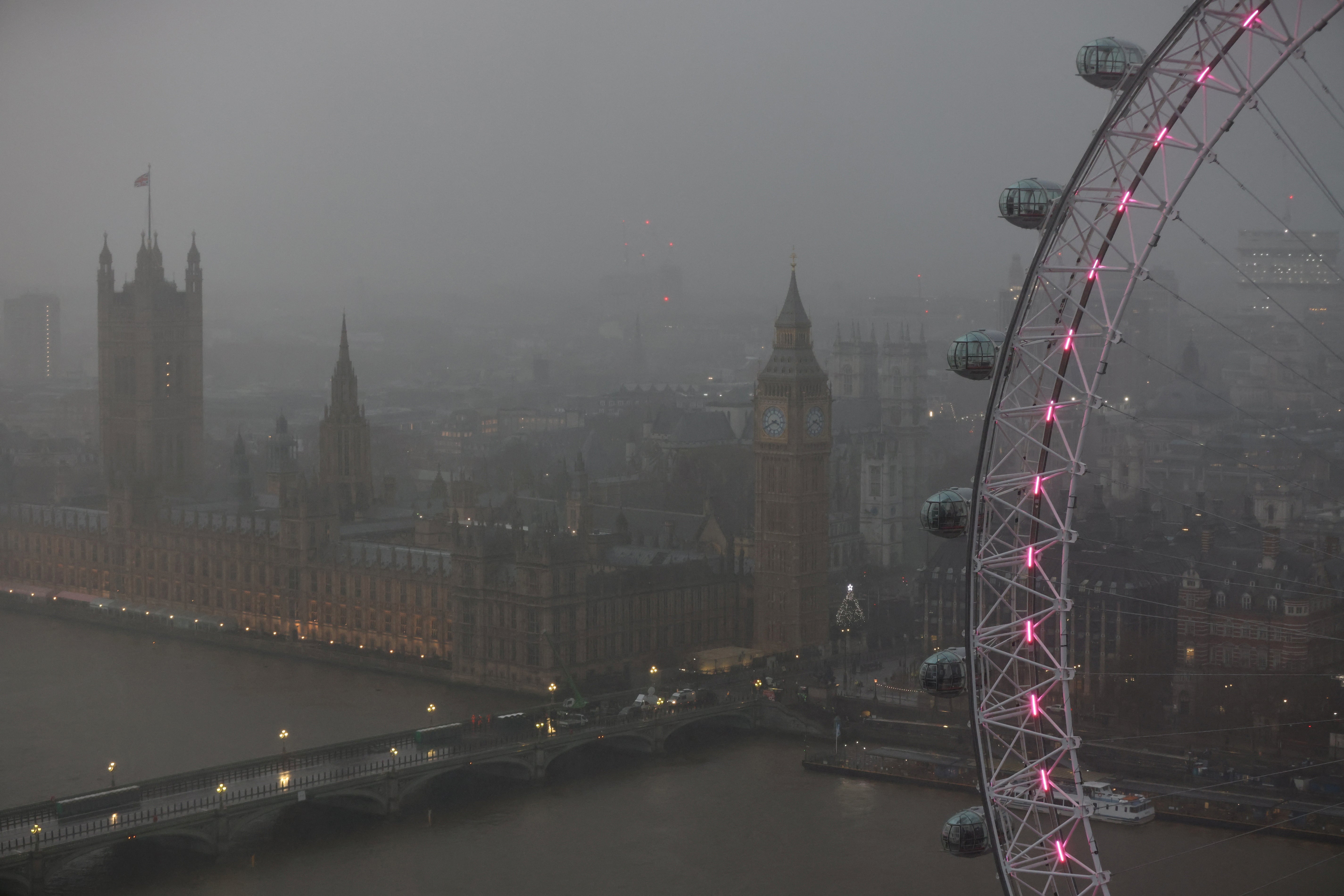 Rain falls over the Houses of Parliament ahead of the New Year’s Eve fireworks, 2023