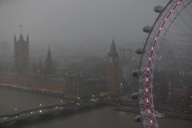 <p>Rain falls over the Houses of Parliament ahead of the New Year’s Eve fireworks, 2023 </p>