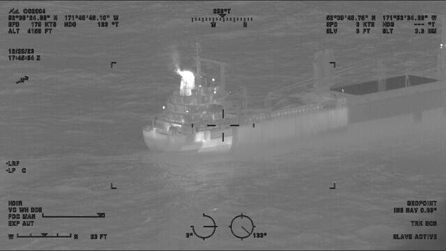 <p>The cargo vessel, pictured above by the US Coast Guard, was docked 2 miles off the Alaskan coast as responders attended to the fire</p>