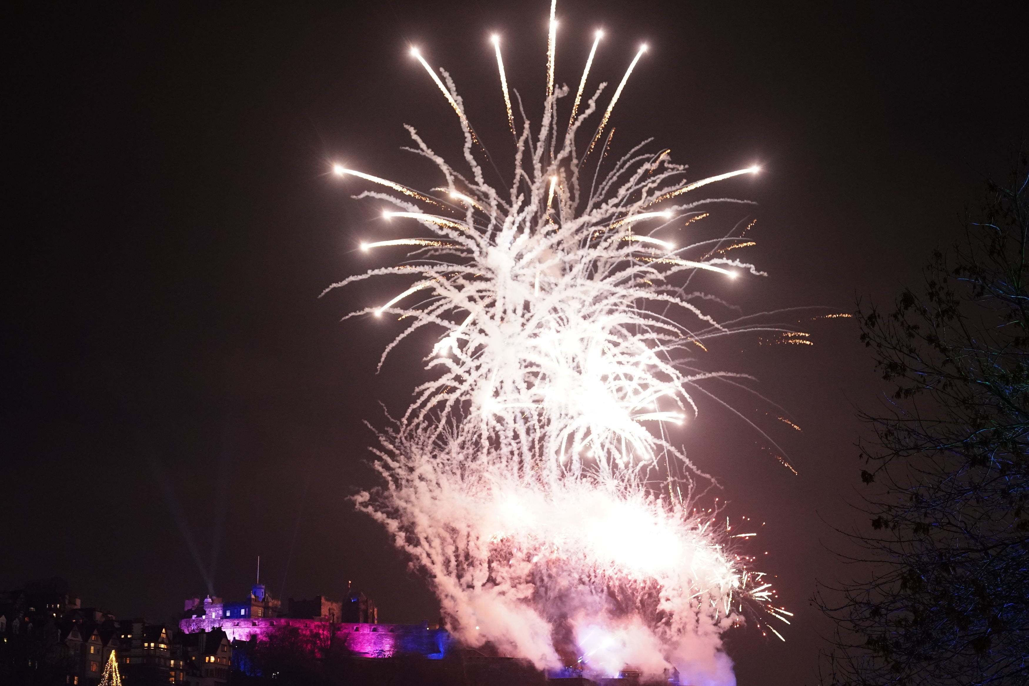 Fireworks explode over Edinburgh Castle as the city held the 30th Hogmanay street party