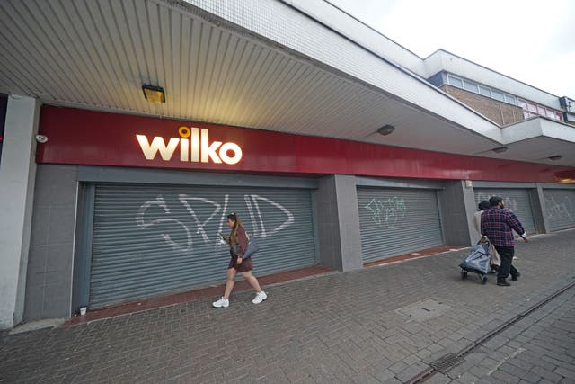 People walk past the closed Wilko store in Barking, east London (Yui Mok/PA)