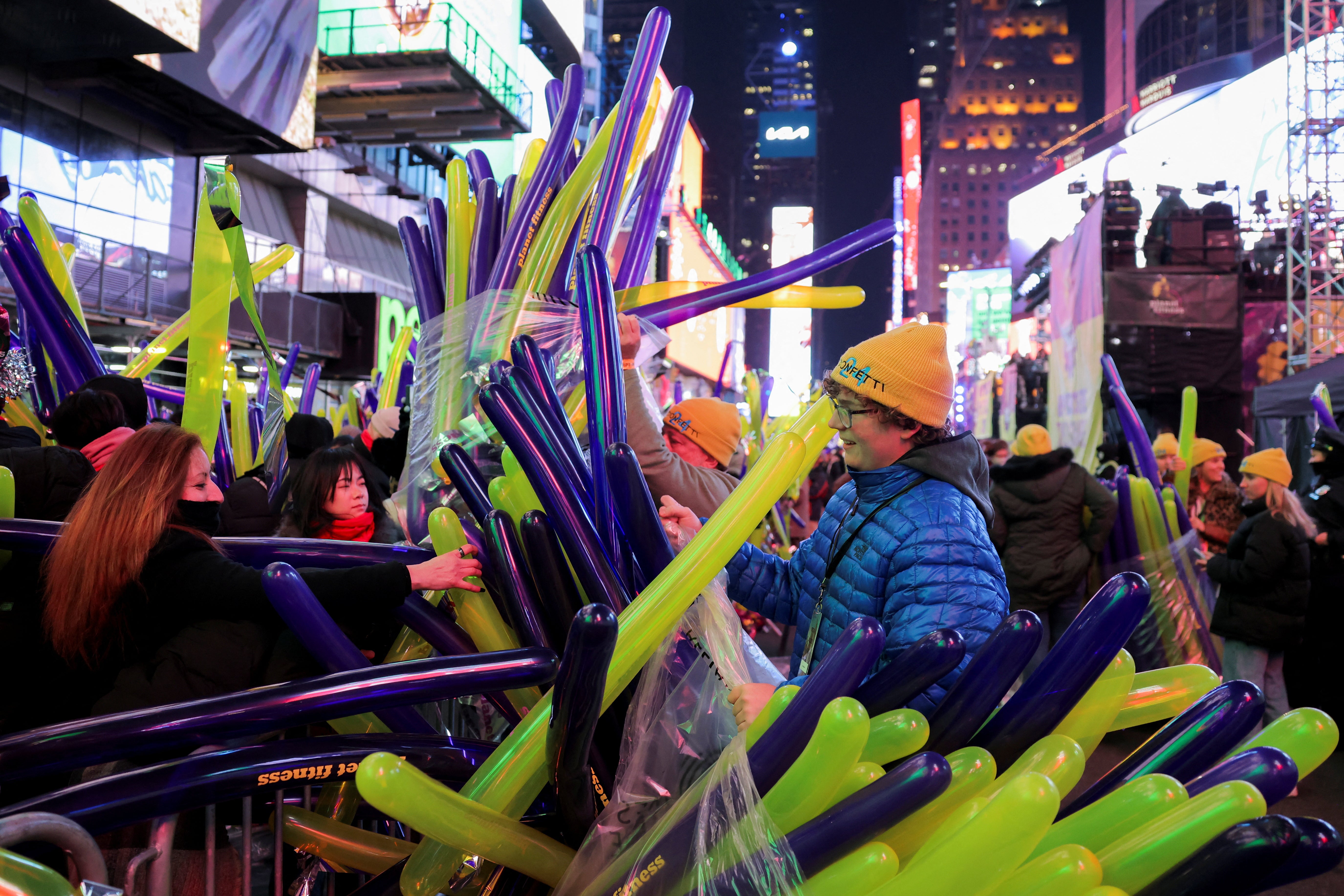 Balloons are handed out to revellers gathered at Times Square during the New Year’s Eve celebrations, in New York City, New York, US, 31 December 2023