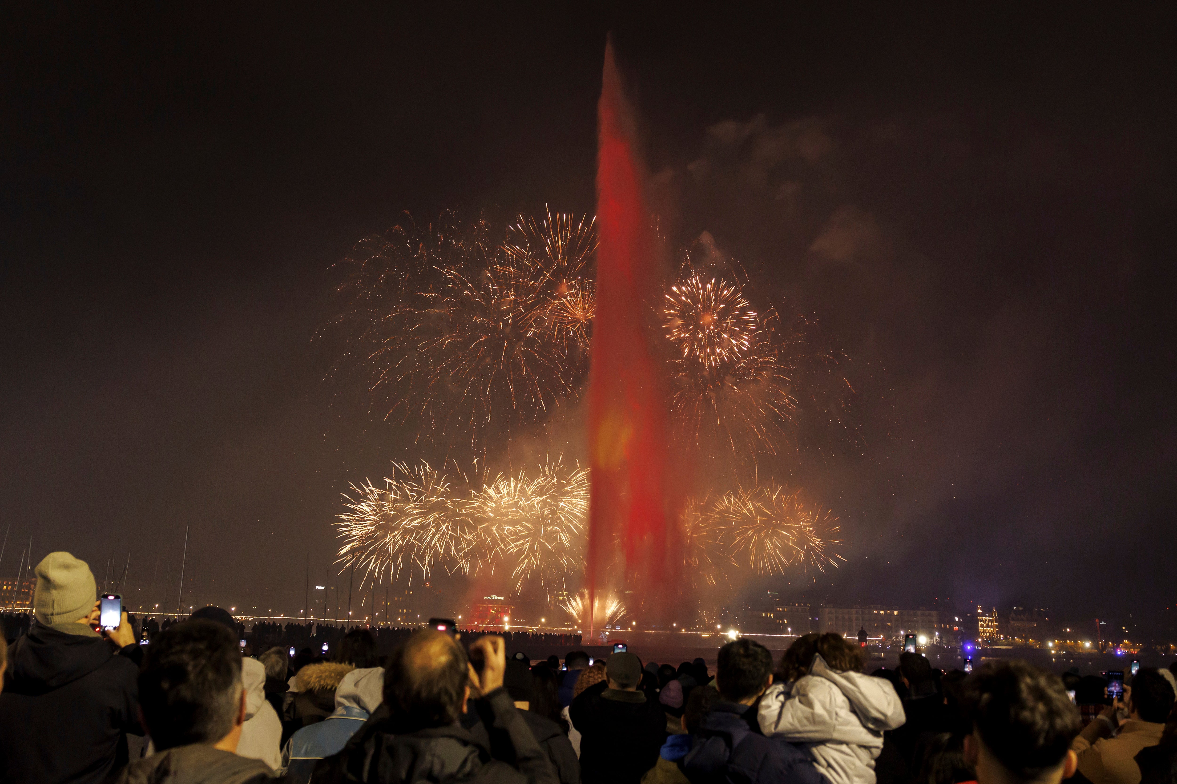 Fireworks illuminate the sky in bay of Geneva behind the famous water fountain “Le Jet d’Eau” during New Year celebrations in Geneva, Switzerland, Monday, 1 January2024