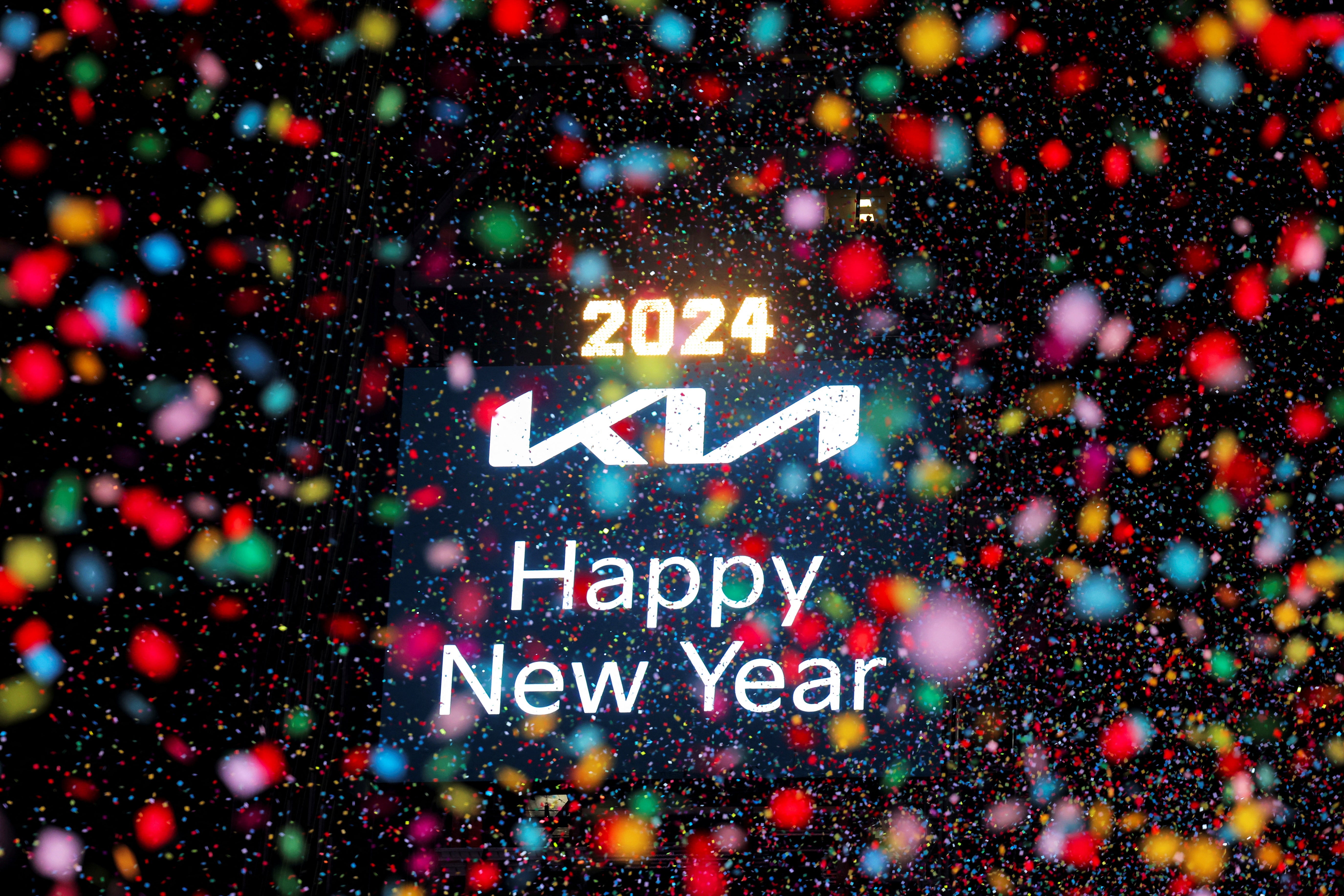 Confetti flies around after the clock strikes midnight during New Year celebrations at Times Square, in New York City, New York, US, 1 January 2024