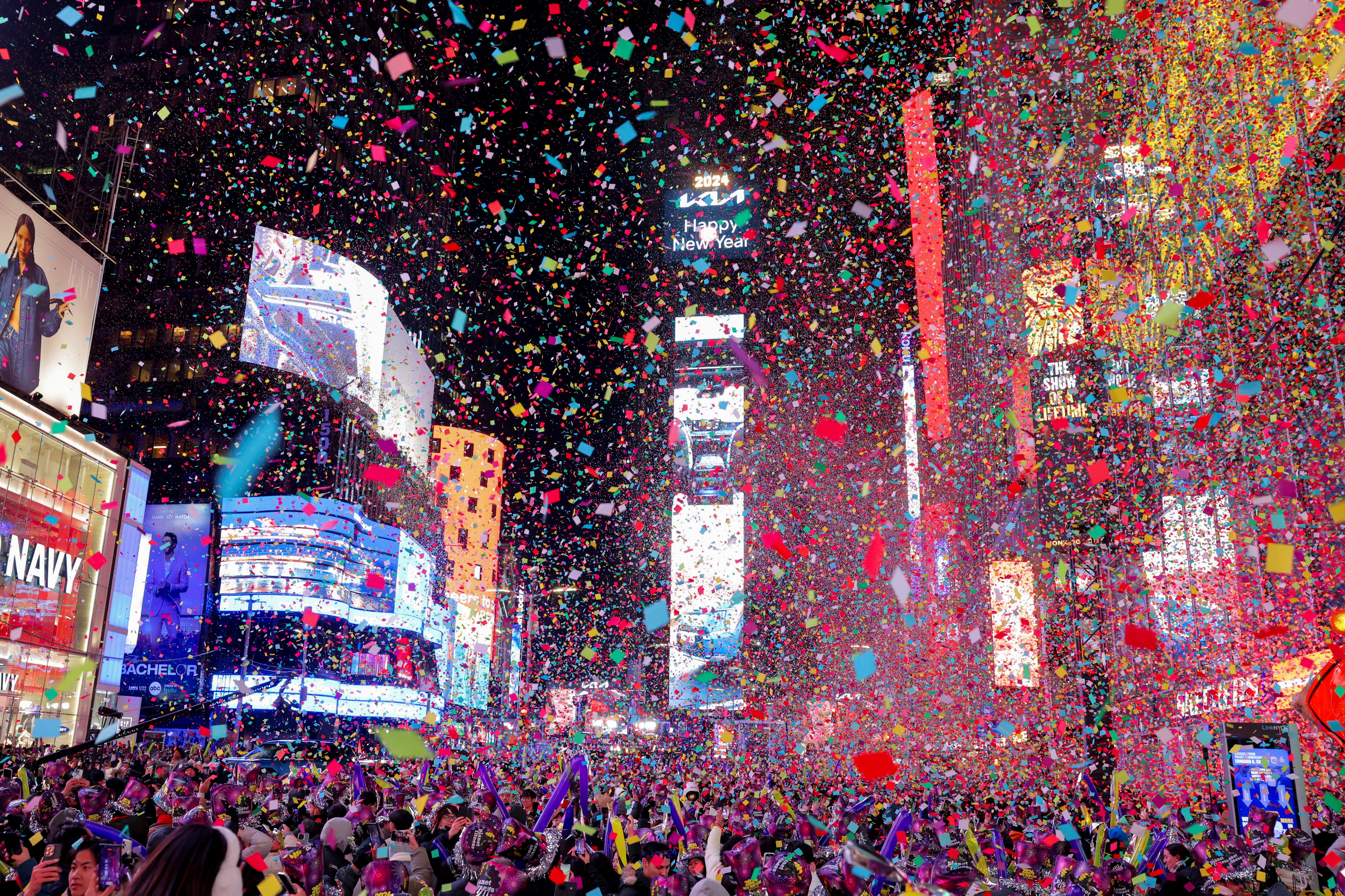 People watch confetti flying around after the clock strikes midnight during New Year celebrations at Times Square, in New York City, New York, US