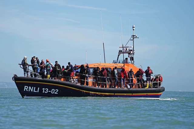 <p>A group of people thought to be migrants are brought in to Dungeness, Kent, aboard an RNLI Dungeness Lifeboat following an incident in the Channel</p>