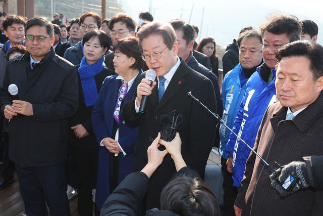 <p>South Korean opposition party leader Lee Jae-myung speaks to reporters as he visits the site of a new airport in Busan on 2 January 2024, moments before the attack </p>