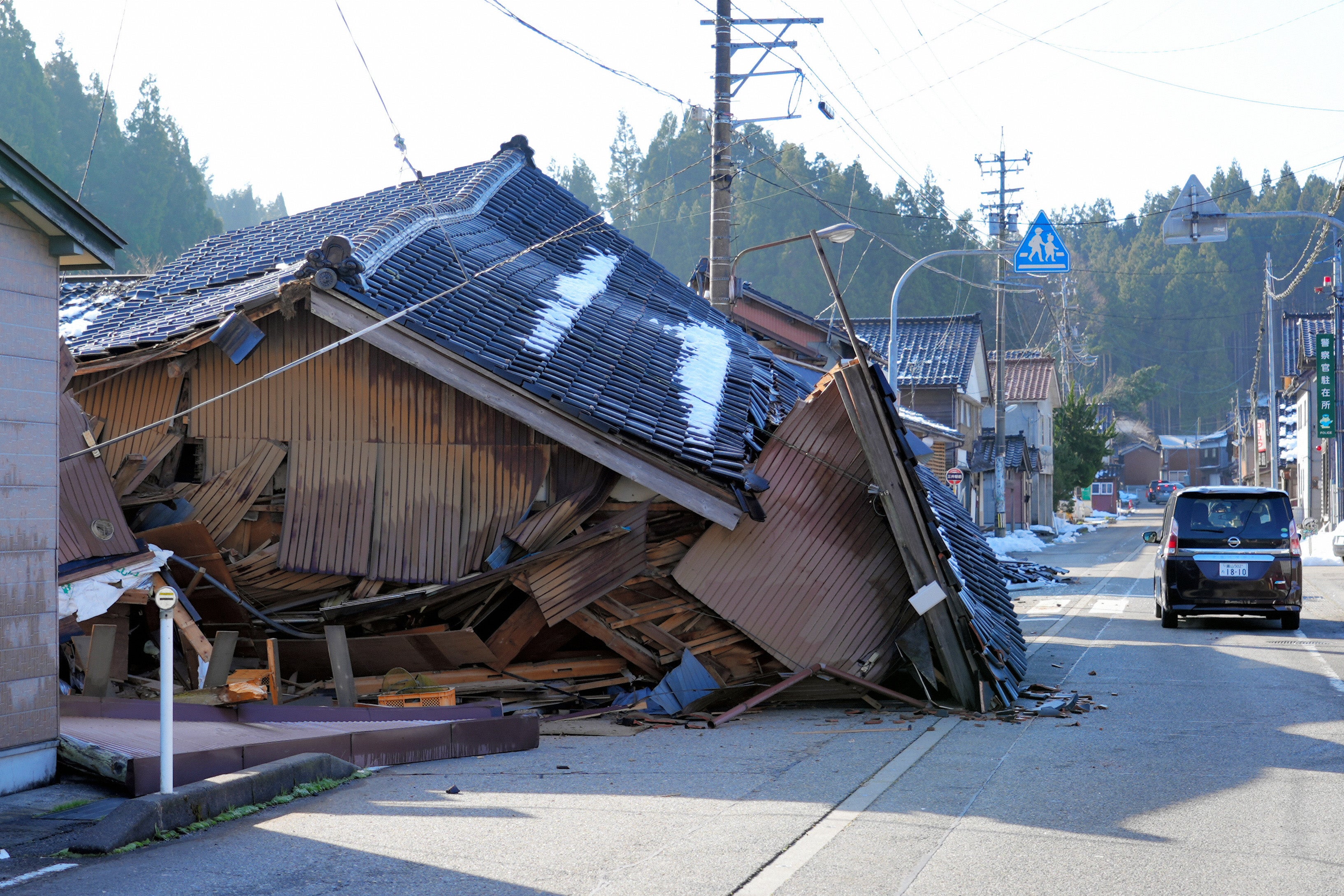 Collapsed houses are seen after multiple strong earthquakes the previous day on 2 January in Wajima, Ishikawa, Japan
