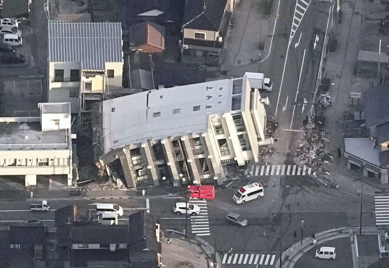An aerial view shows a collapsed building caused by an earthquake in Wajima, Ishikawa prefecture