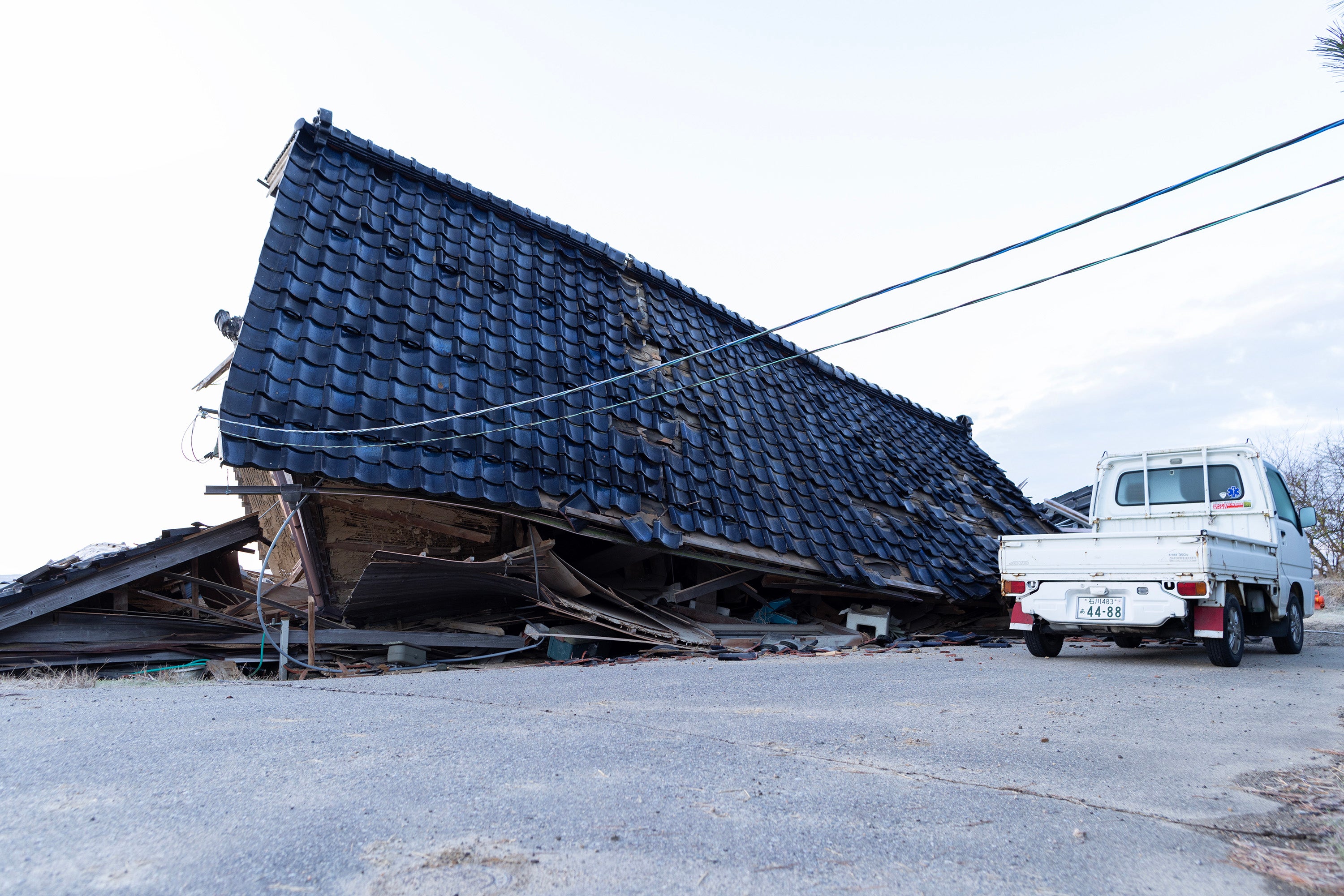 A collapsed house is seen on 2 January, 2024 in Nanao, Japan