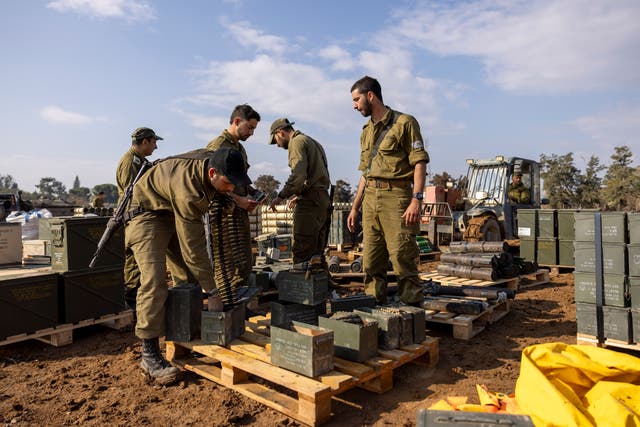 <p>Israeli soldiers pack ammunition at a staging area on 2 January 2024 in Southern Israel, near the border to Gaza</p>