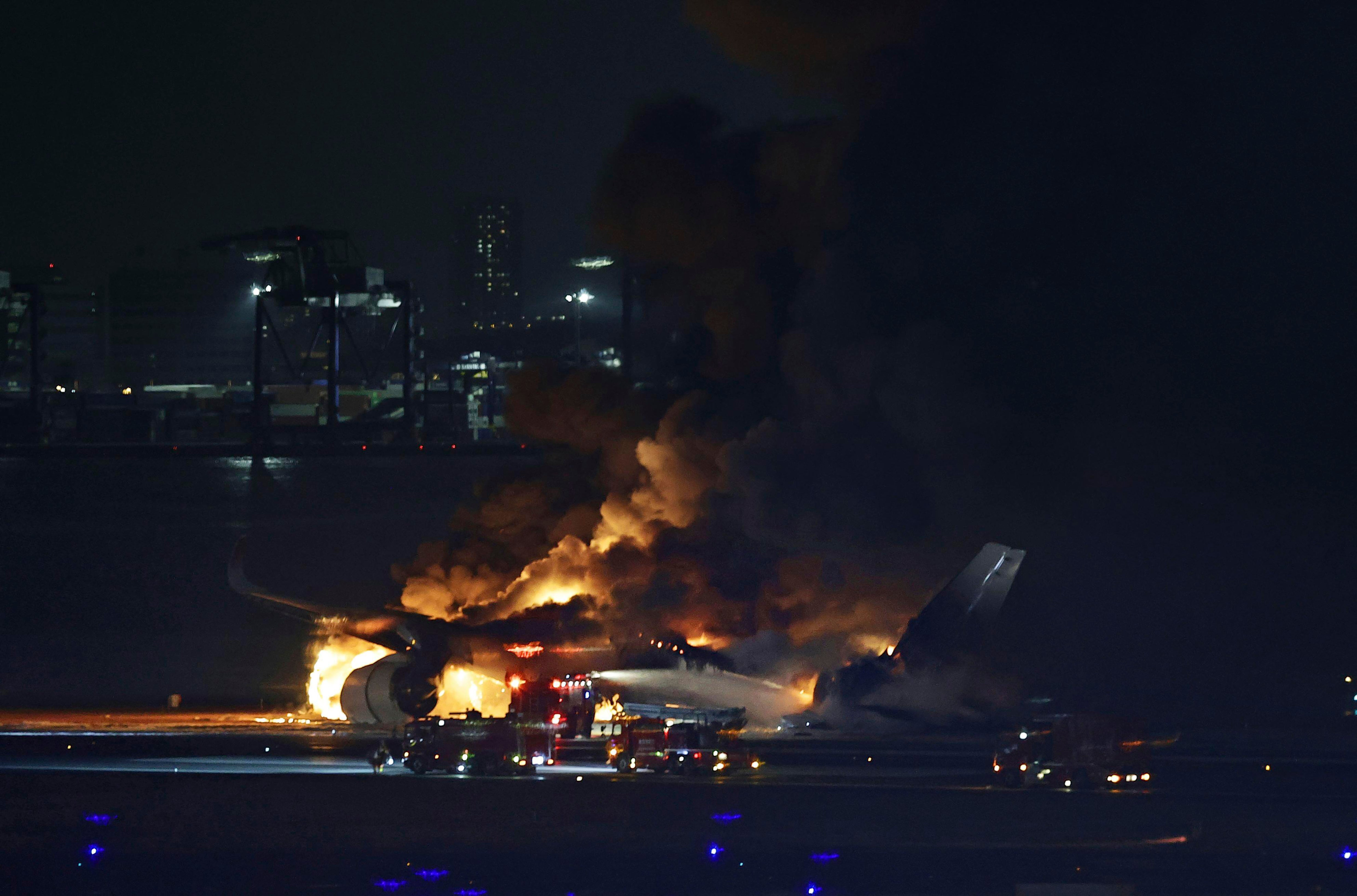 A Japan Airlines plane is on fire on the runway of Haneda airport on Tuesday, 2 January 2024 in Tokyo, Japan