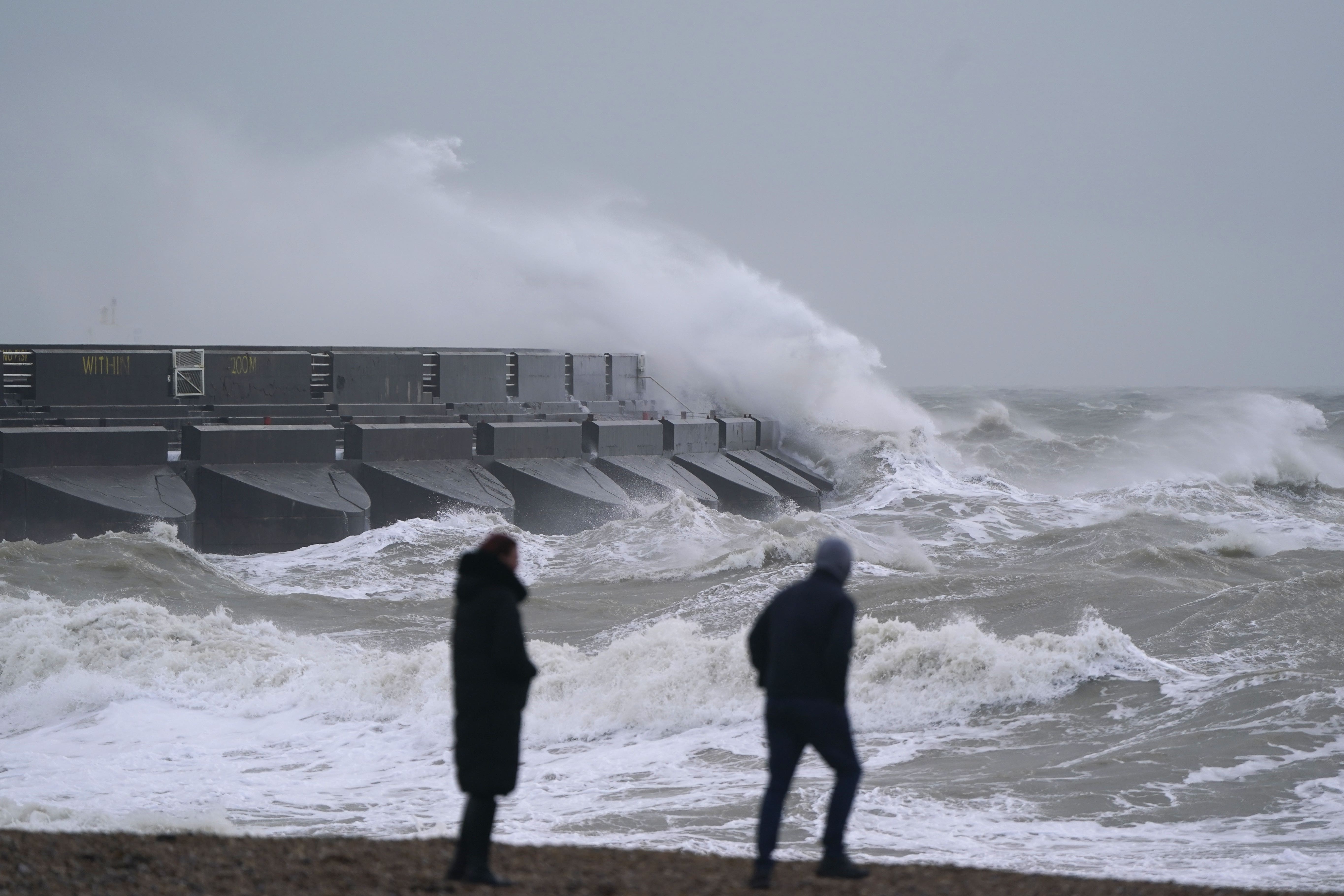 People are advised to take care along the coast as strong winds bring large crashing waves (Andrew Matthews/PA)