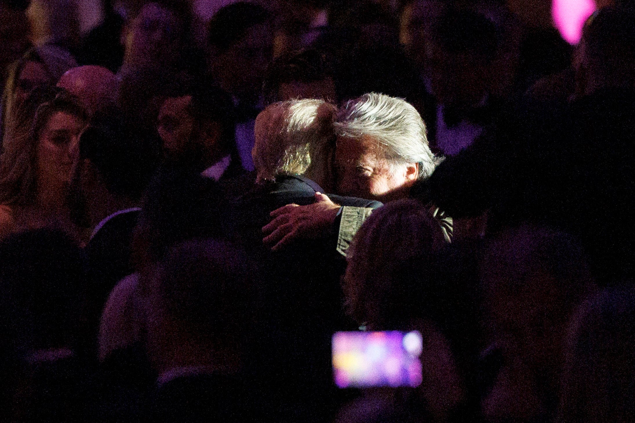 Donald Trump hugs his former chief strategist Steve Bannon at a New York Young Republicans gala on 9 December