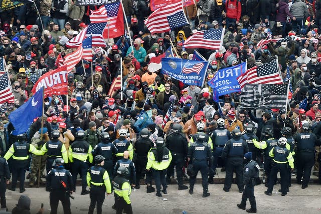 <p>Trump supporters clash with police and security forces as they storm the US Capitol in Washington, DC on January 6, 2021</p>