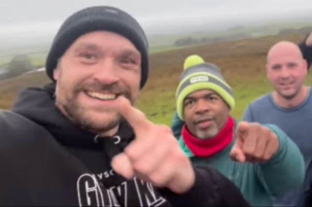 <p>Tyson Fury (left) out running ahead of his fight with Oleksandr Usyk</p>