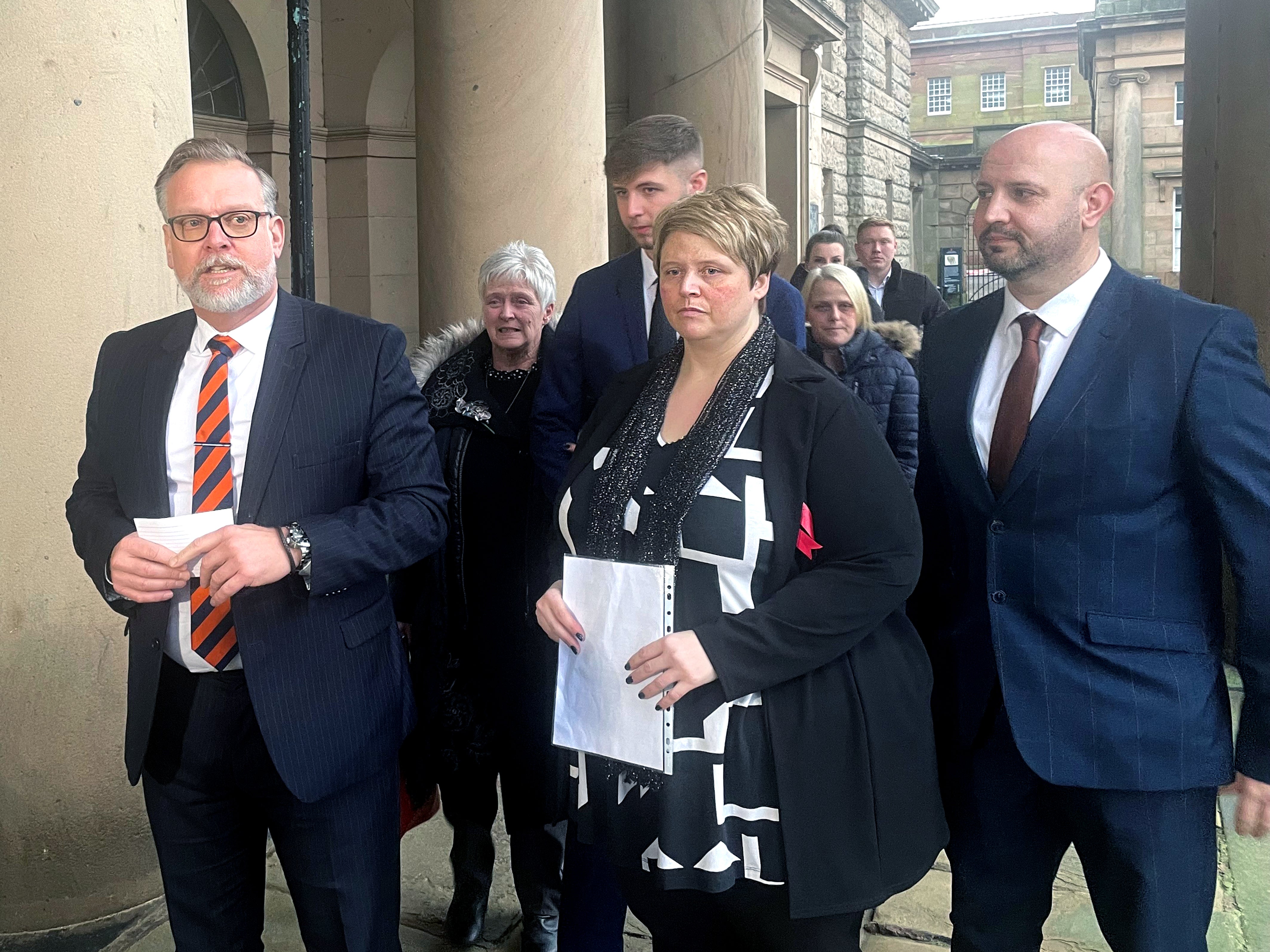 <p>Detective Inspector Nigel Parr of Cheshire Constabulary (left) with Lisa Watson, 44, (centre), mother of murder victim Ryan Watson, alongside family members outside Chester Crown Court</p>