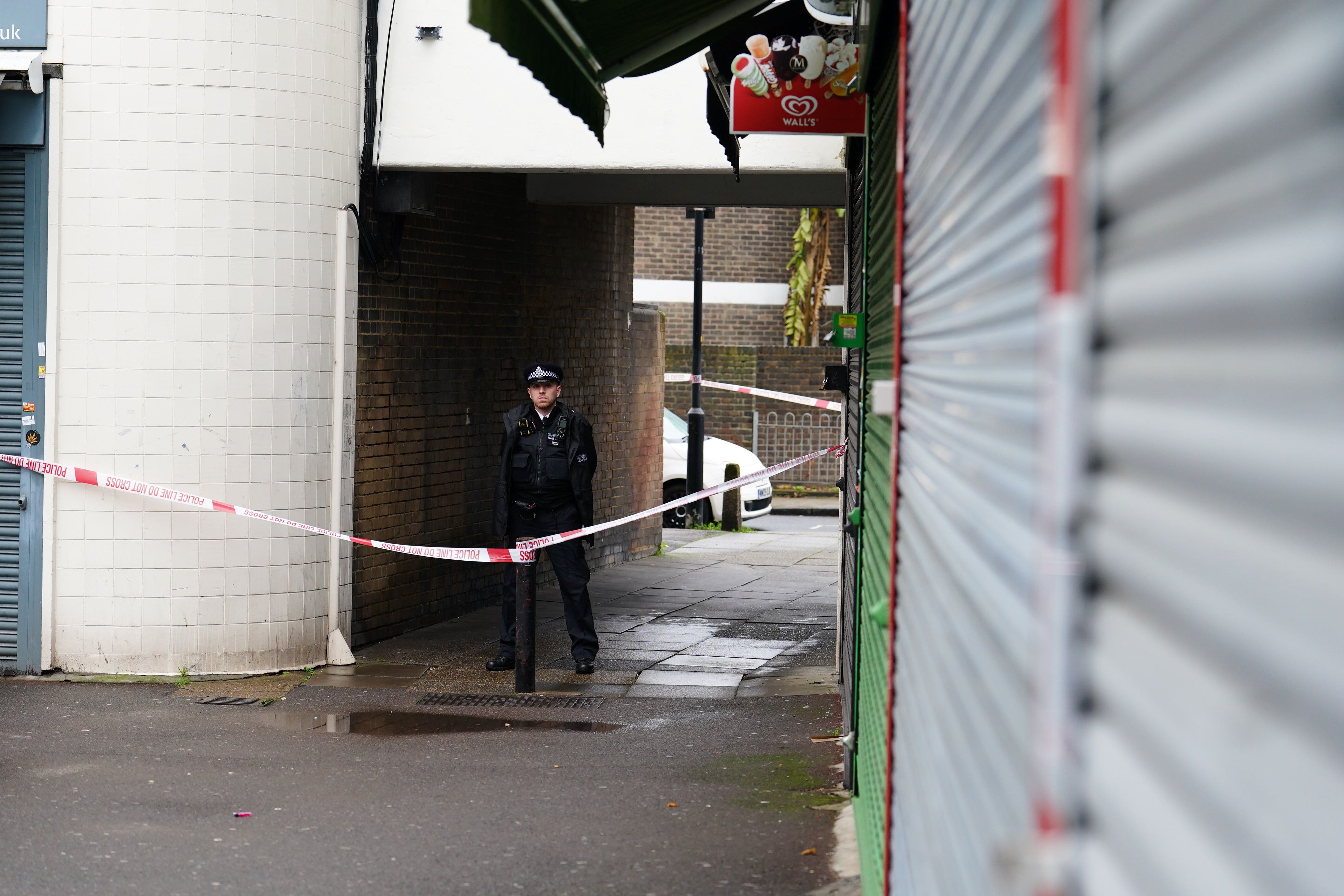 A police officer close to the scene in Bermondsey where Kacey Clarke was fatally stabbed (Jordan Pettitt/PA)