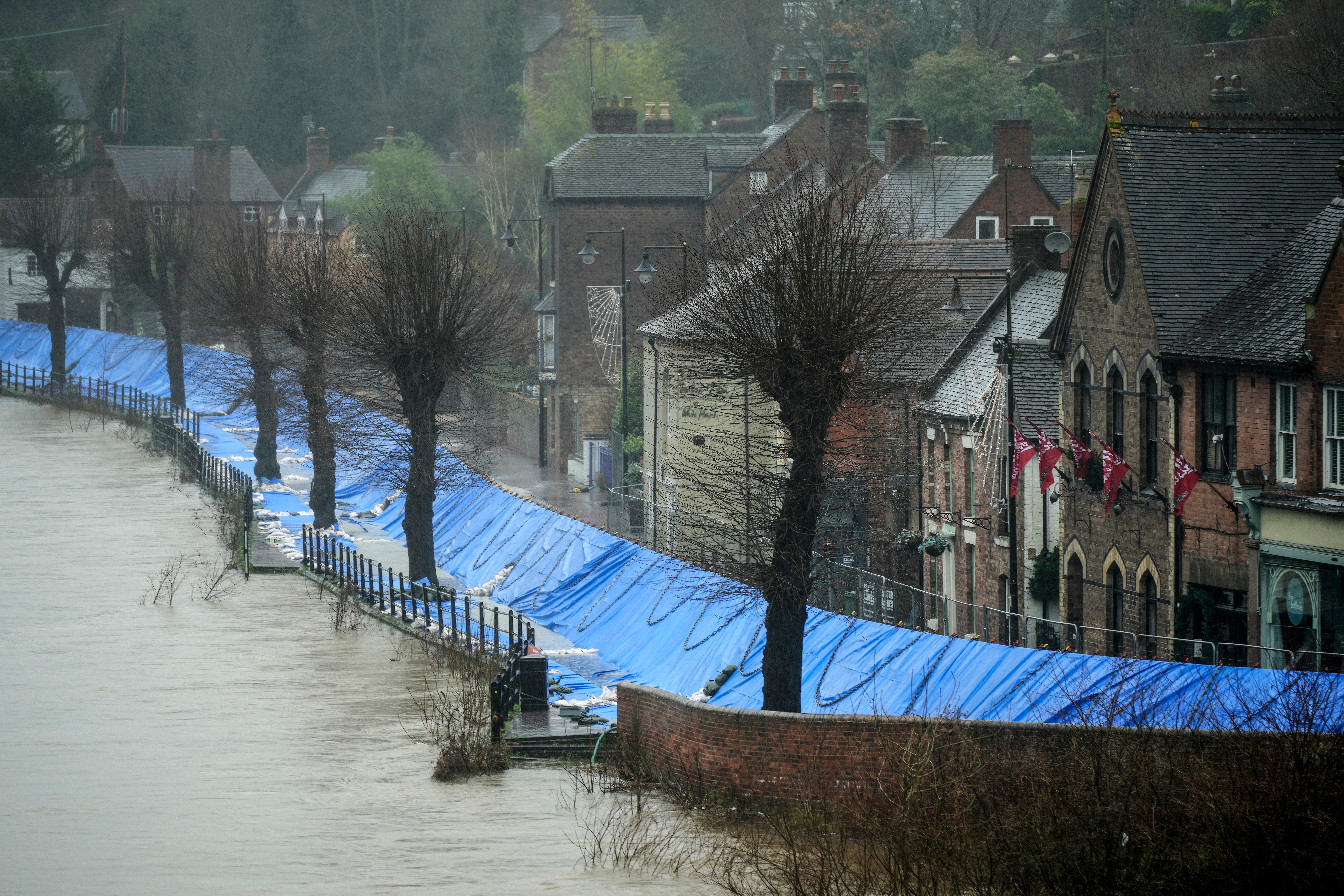 Flood defences were deployed to protect businesses and homes along the river severn on tuesday