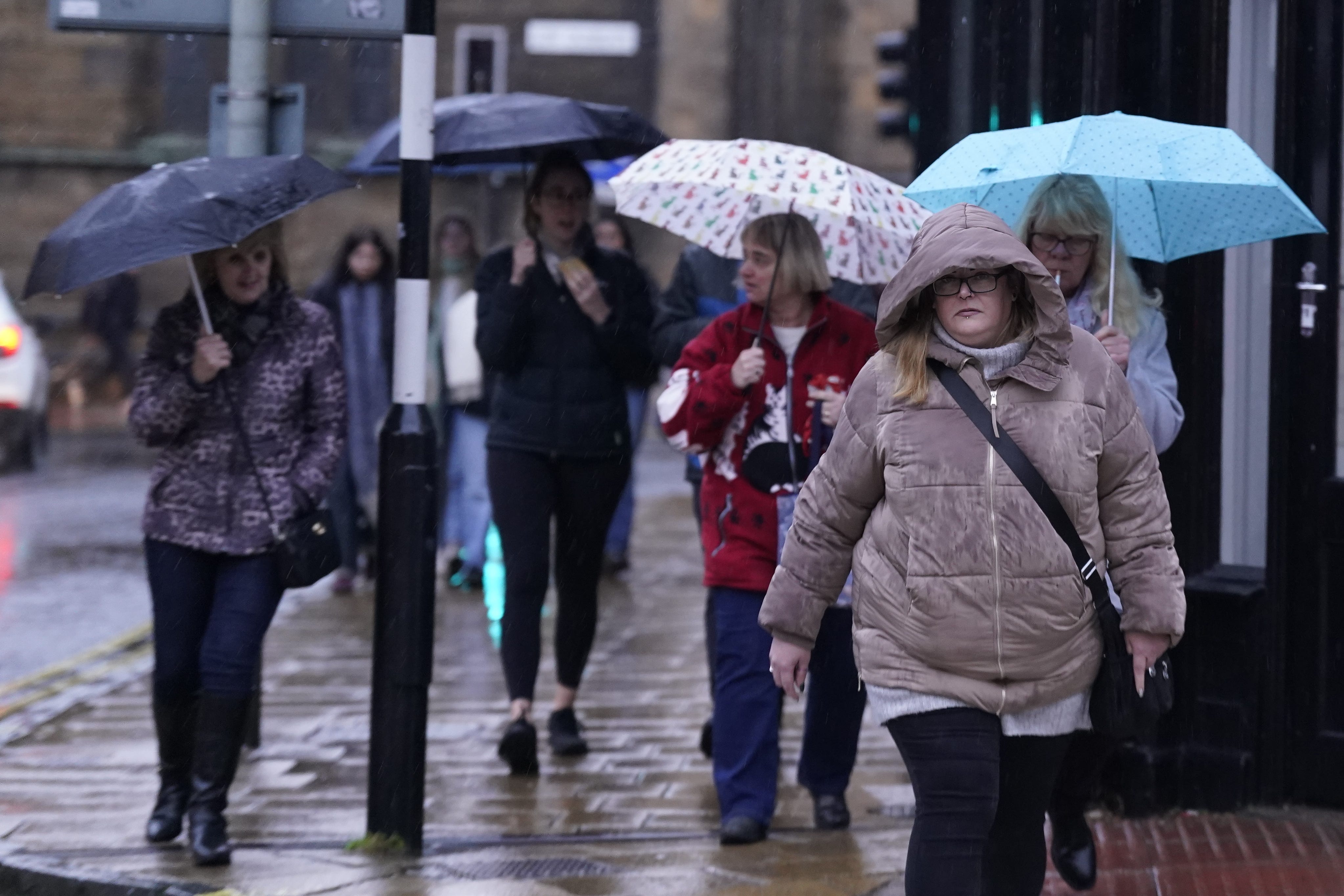 People walk in the rain in York, Yorkshire (Danny Lawson/PA)