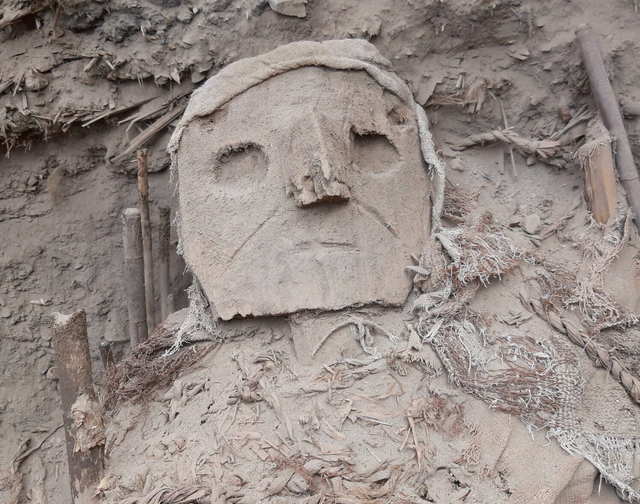 <p>Carved wood mask on the so-called ‘false head’ of a burial tomb, Pachacamac, Peru</p>