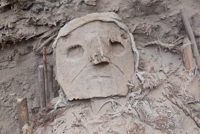 <p>Carved wood mask on the so-called ‘false head’ of a burial tomb, Pachacamac, Peru</p>